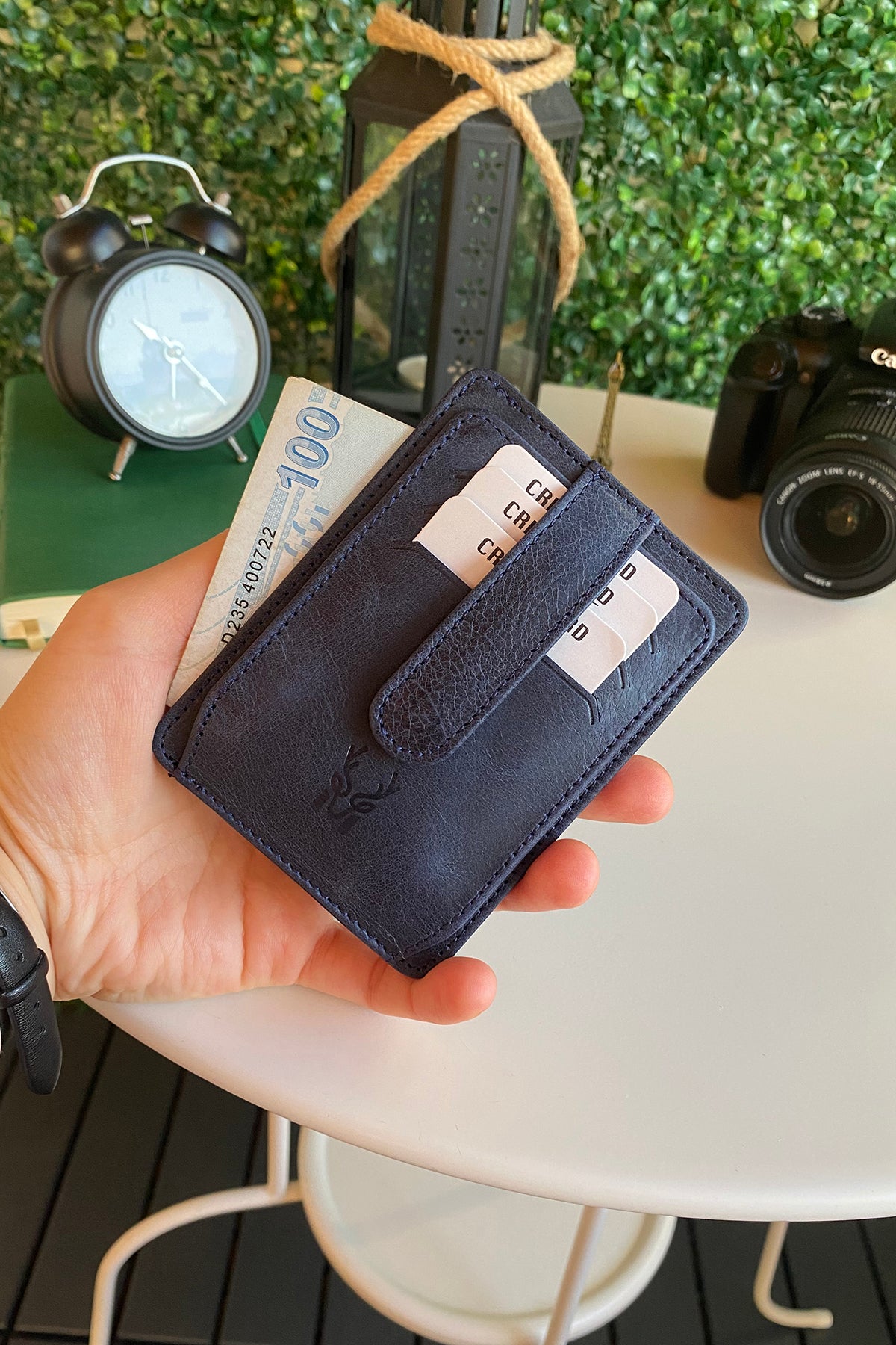 Zona Genuine Leather Card Holder showcasing its sleek design, ID window, and multiple card slots.