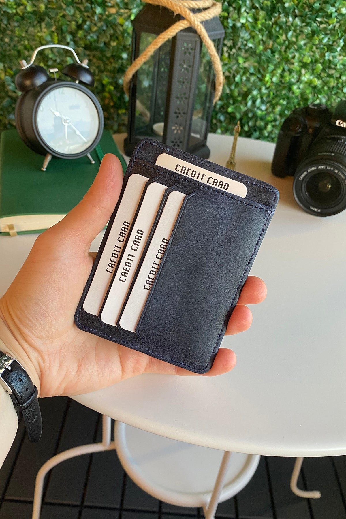 Zona Genuine Leather Card Holder showcasing its sleek design, ID window, and multiple card slots.