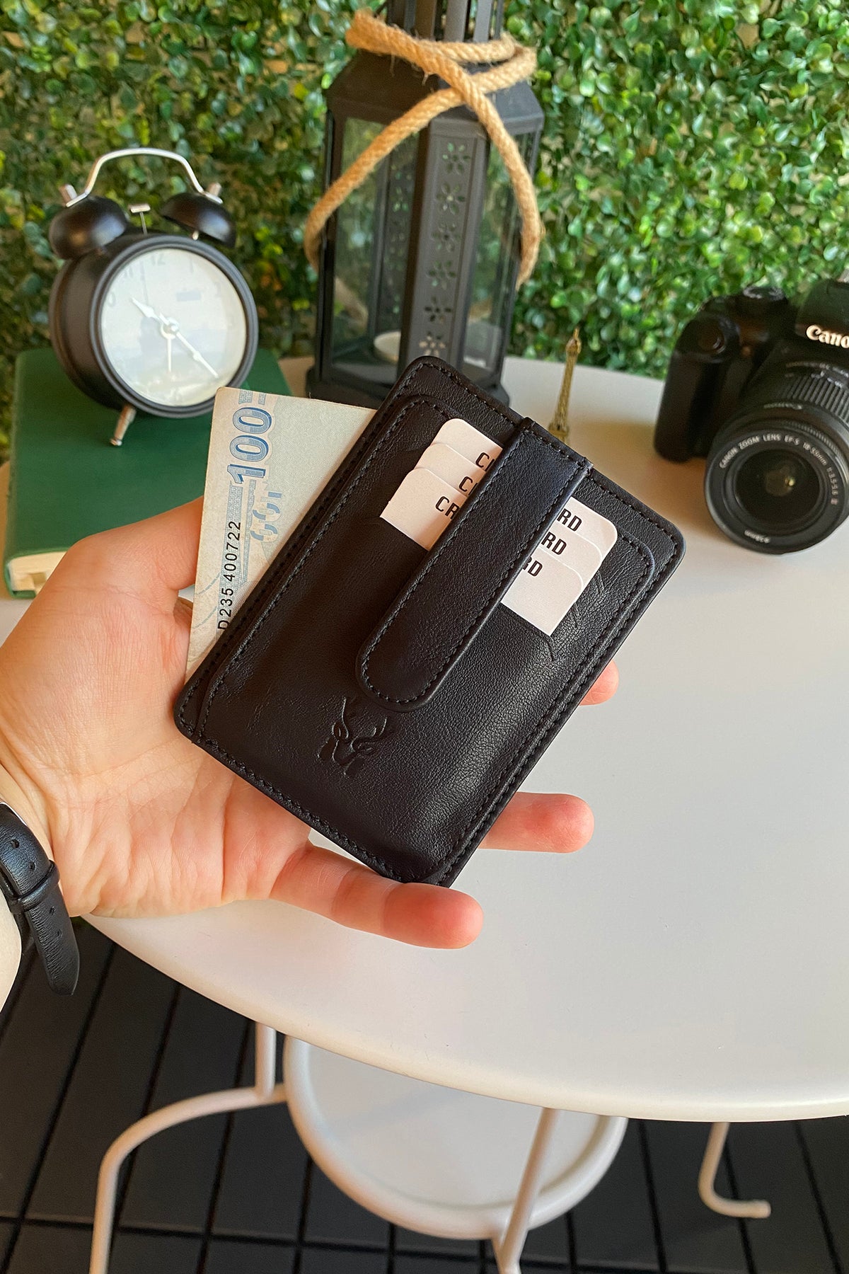 Zona Genuine Leather Card Holder showcasing its sleek design, ID window, and multiple card slots.