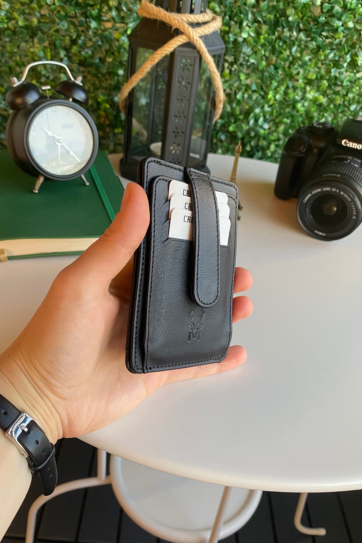 Zona Genuine Leather Card Holder showcasing its sleek design, ID window, and multiple card slots.