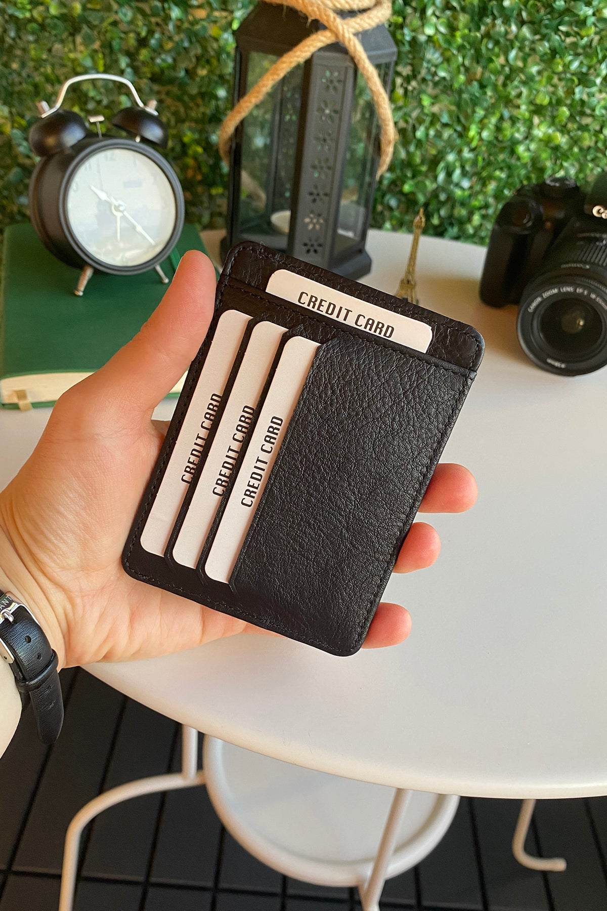 Zona Genuine Leather Card Holder showcasing its sleek design, ID window, and multiple card slots.