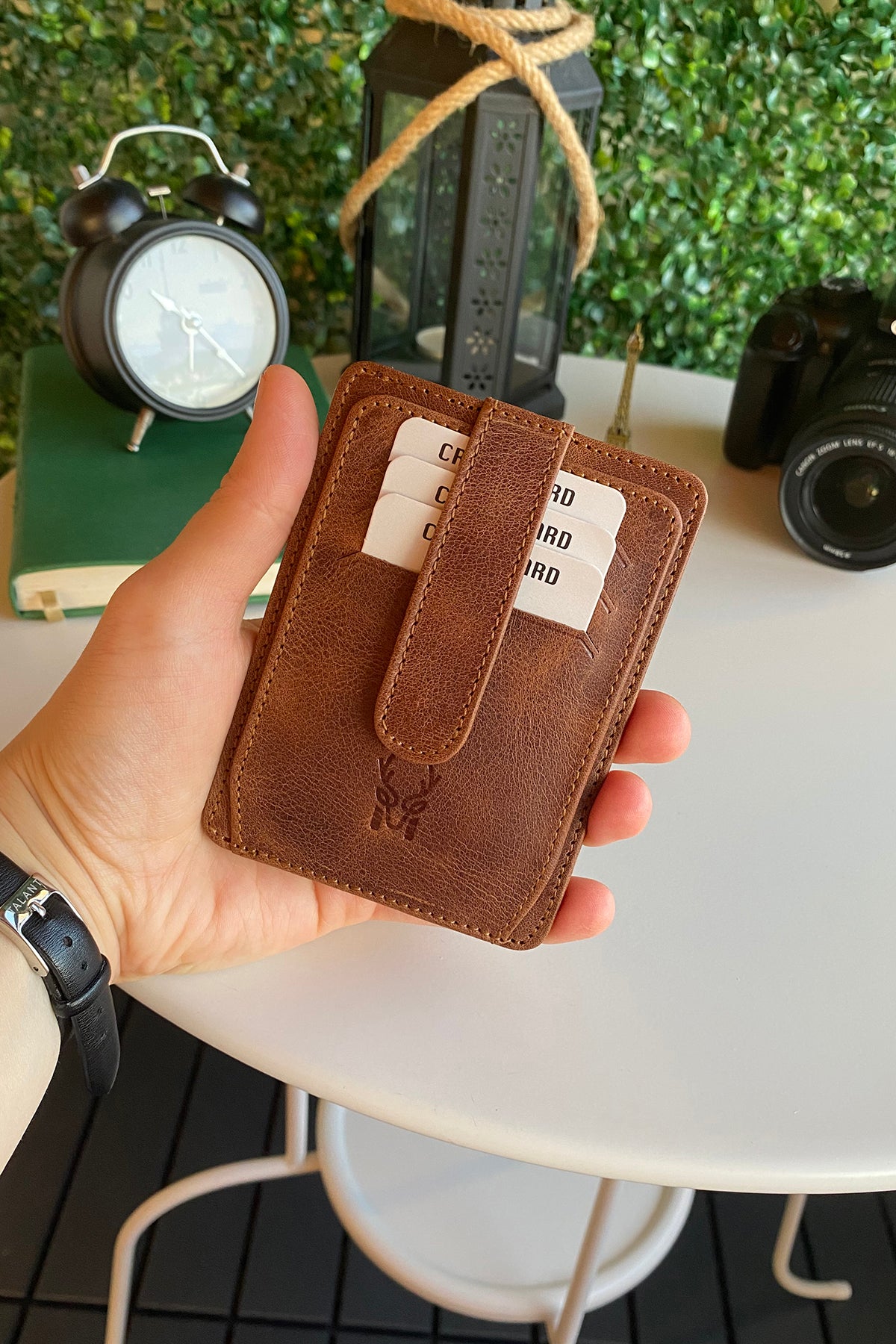 Zona Genuine Leather Card Holder showcasing its sleek design, ID window, and multiple card slots.