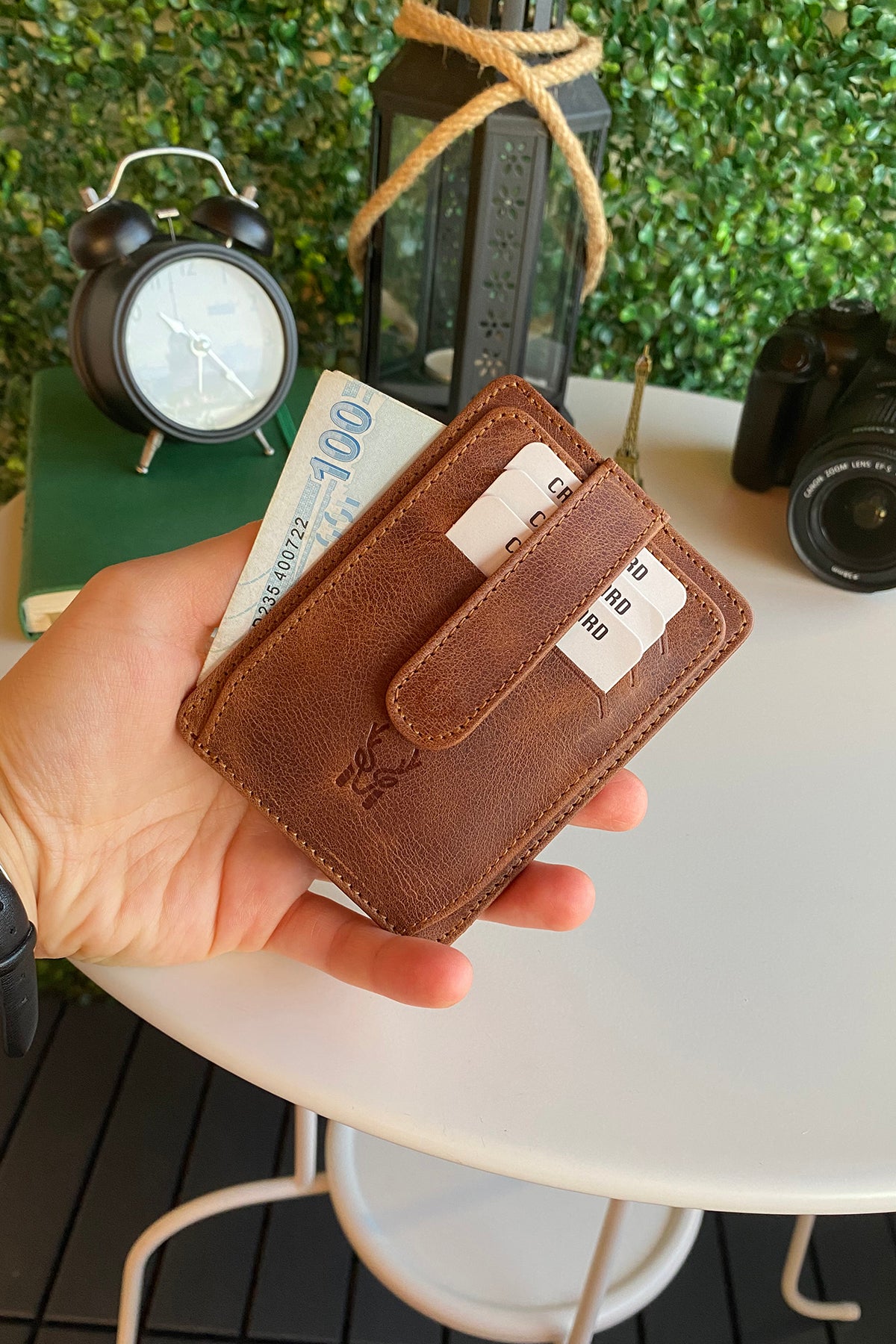 Zona Genuine Leather Card Holder showcasing its sleek design, ID window, and multiple card slots.