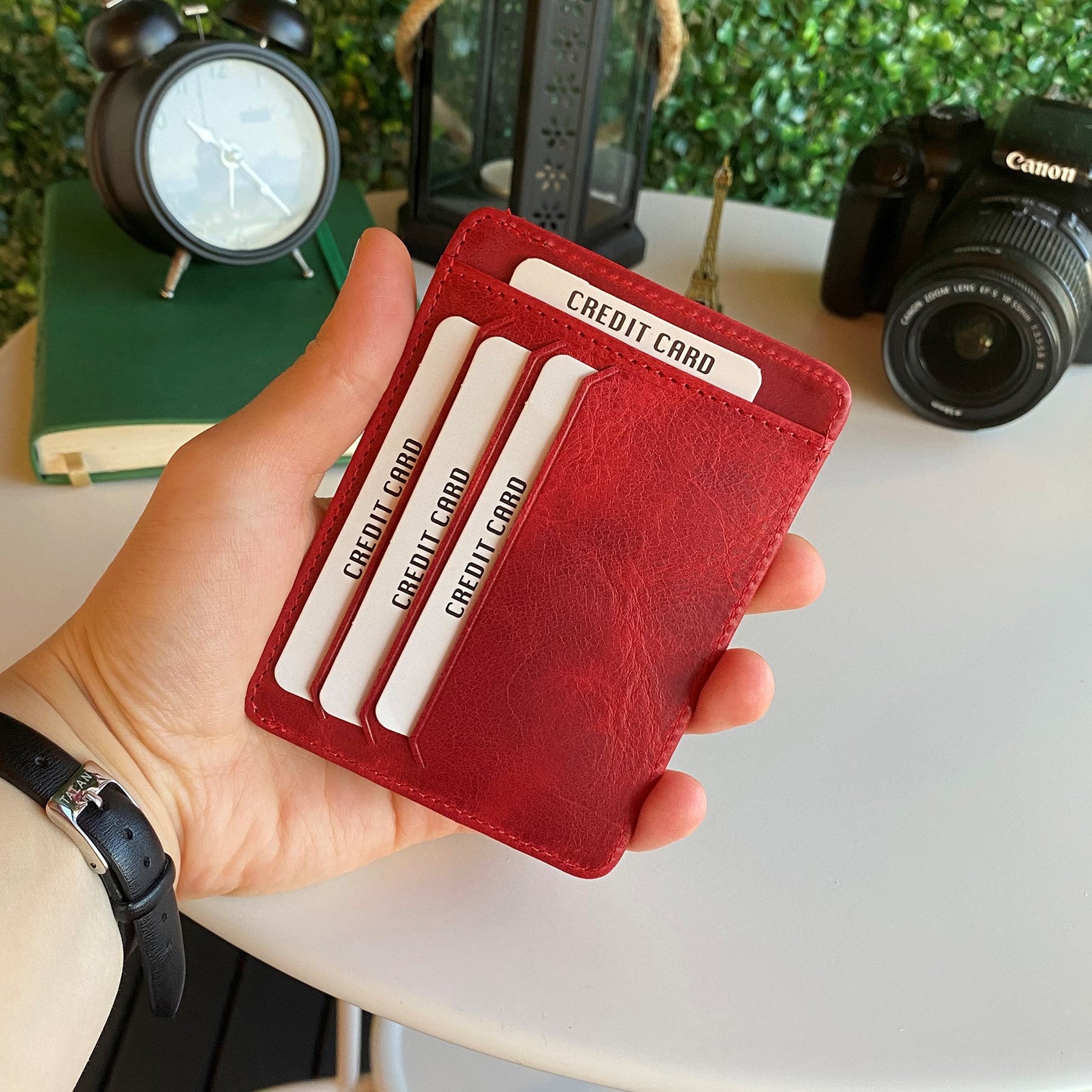 Zona Genuine Leather Card Holder showcasing its sleek design, ID window, and multiple card slots.