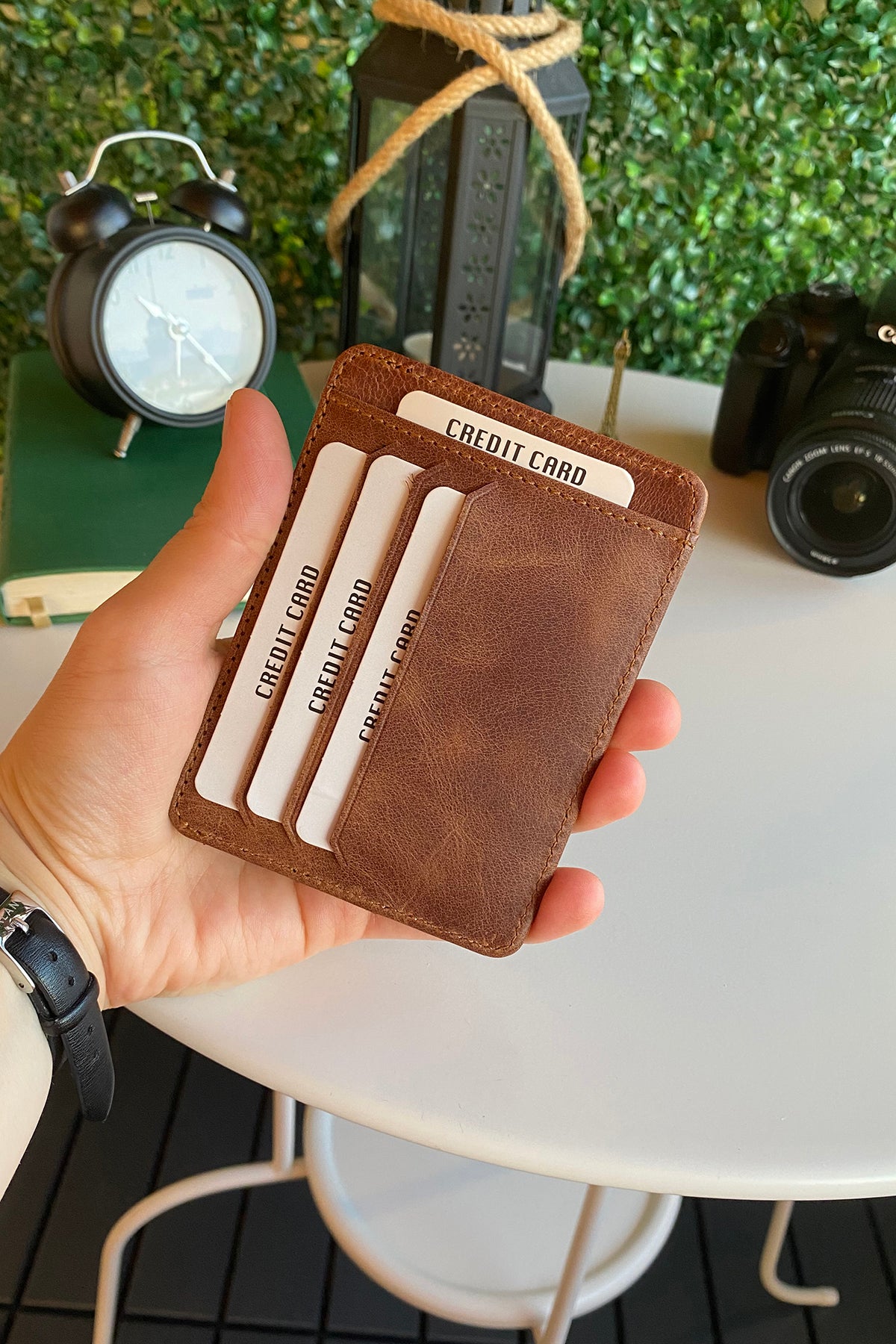 Zona Genuine Leather Card Holder showcasing its sleek design, ID window, and multiple card slots.