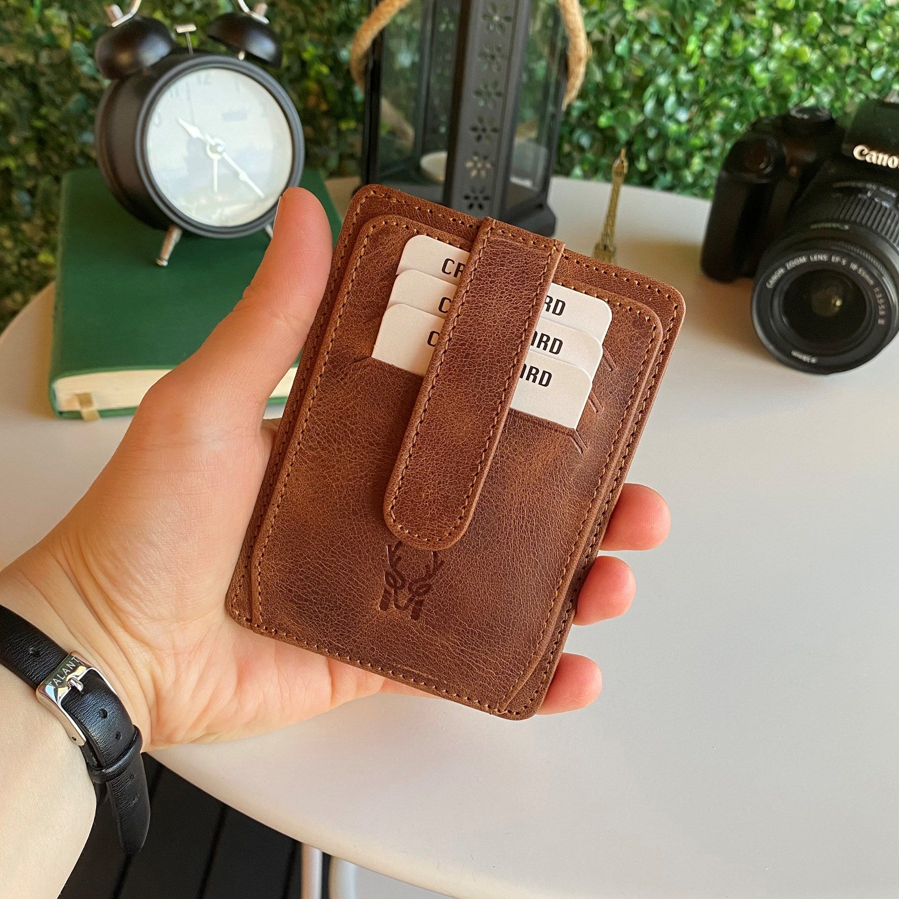 Zona Genuine Leather Card Holder showcasing its sleek design, ID window, and multiple card slots.