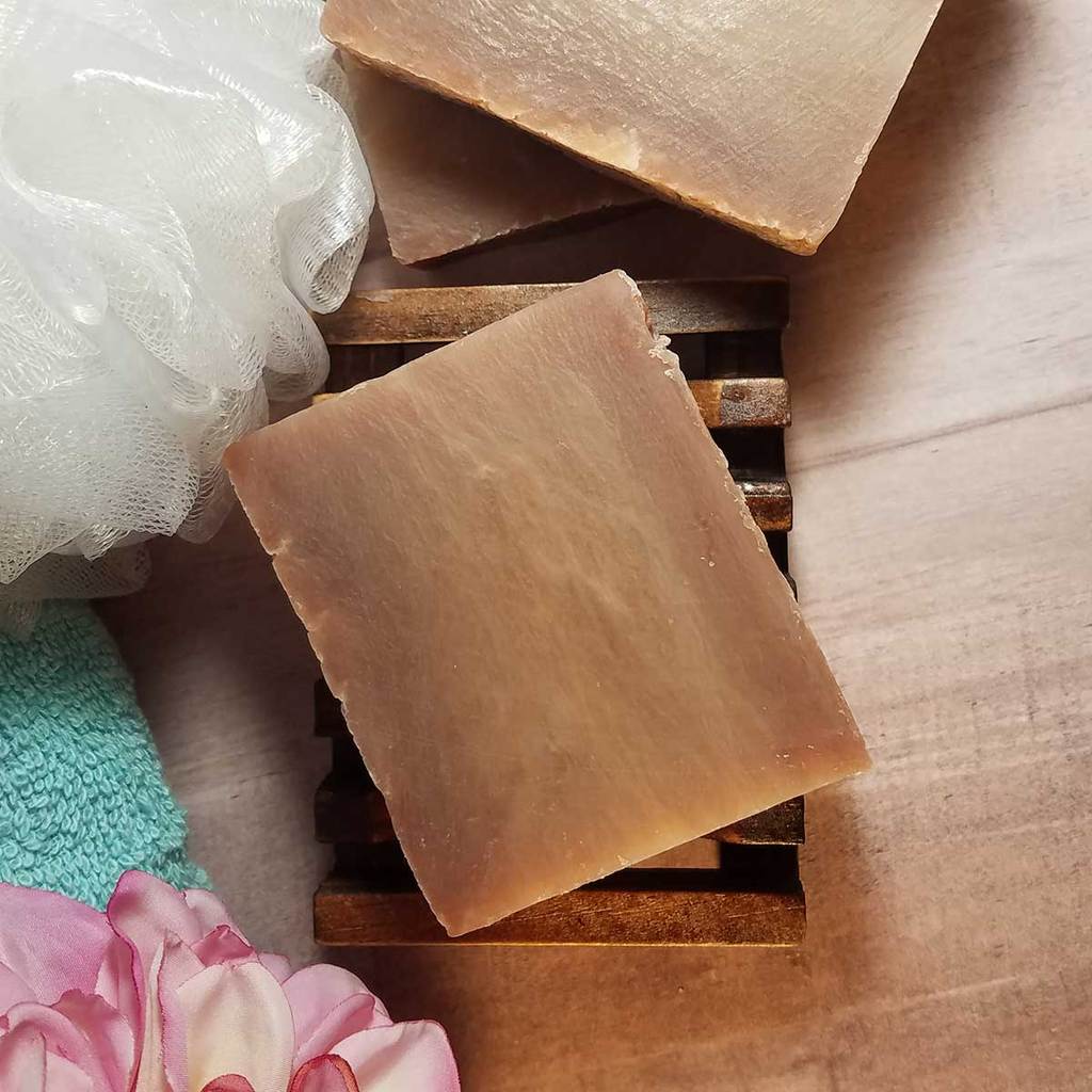 All Natural Coconut Handmade Soap bar with coconut and shea butter, showcasing its creamy texture and rich fragrance.