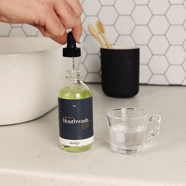 A 4 fl oz bottle of alcohol-free mouthwash concentrate with a fresh mint flavor, designed for gentle oral care.