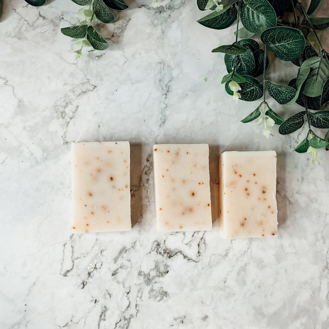 Aloe Eucalyptus soap bar with natural ingredients, showcasing its unique handmade design and vibrant colors.