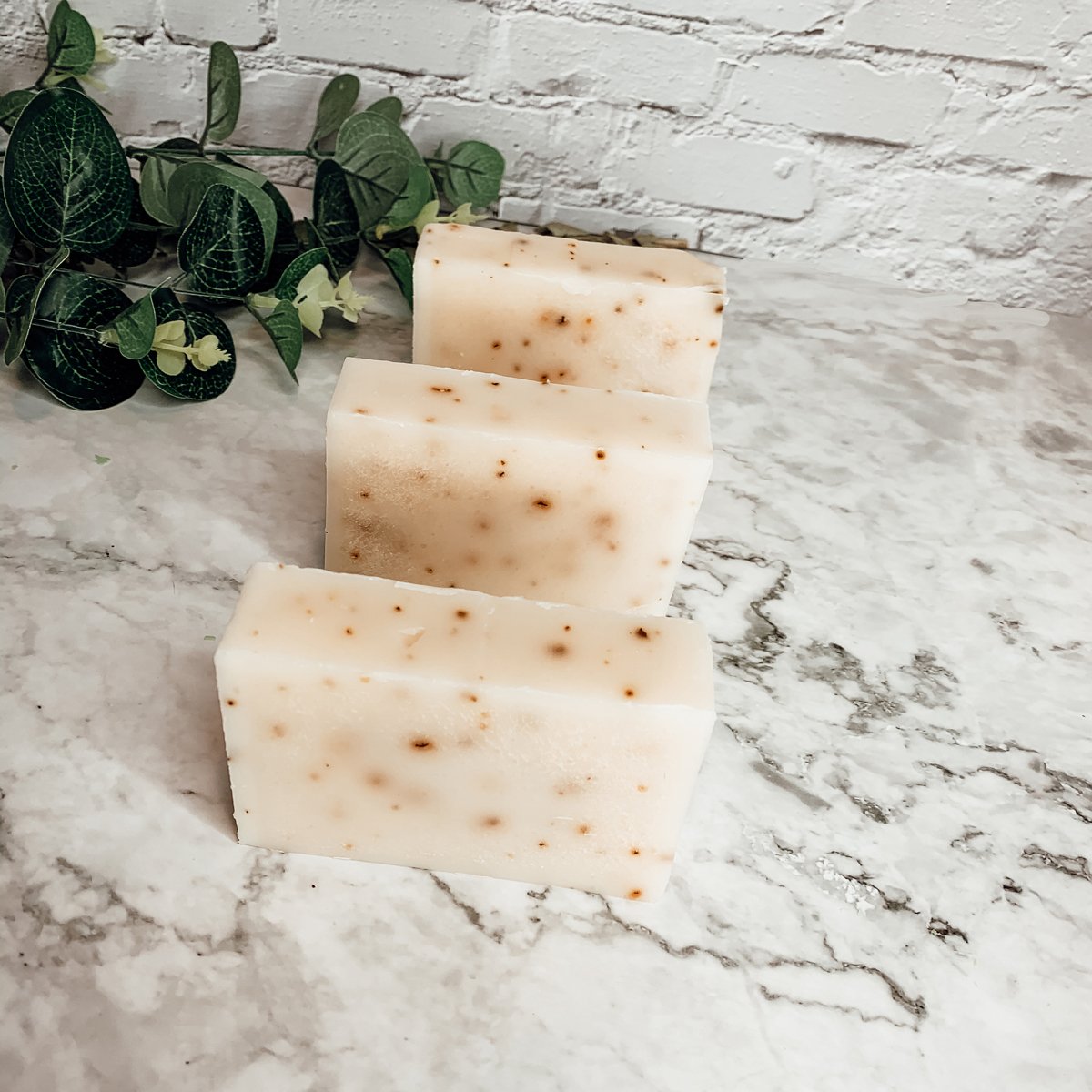 Aloe Eucalyptus soap bar with natural ingredients, showcasing its unique handmade design and vibrant colors.