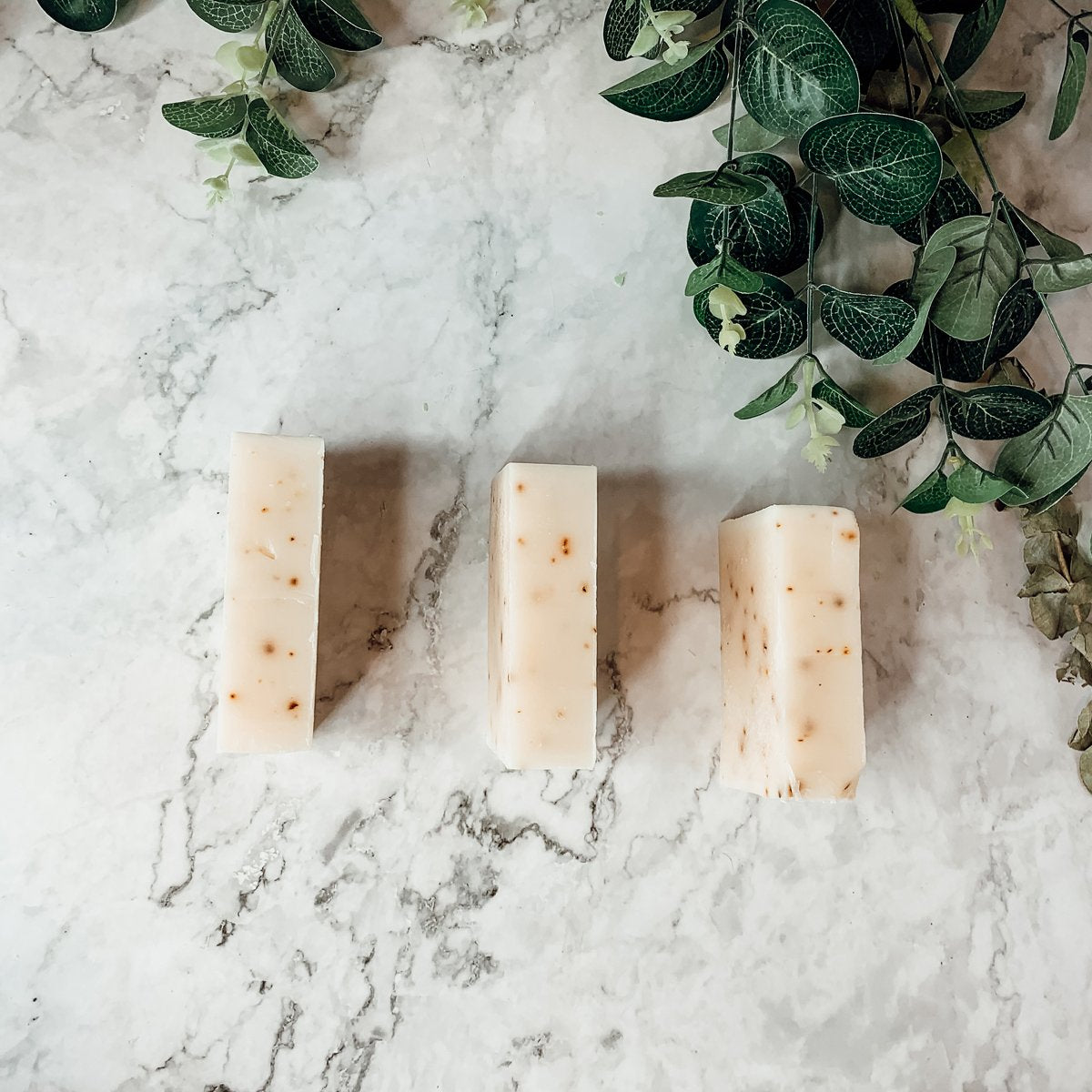 Aloe Eucalyptus soap bar with natural ingredients, showcasing its unique handmade design and vibrant colors.