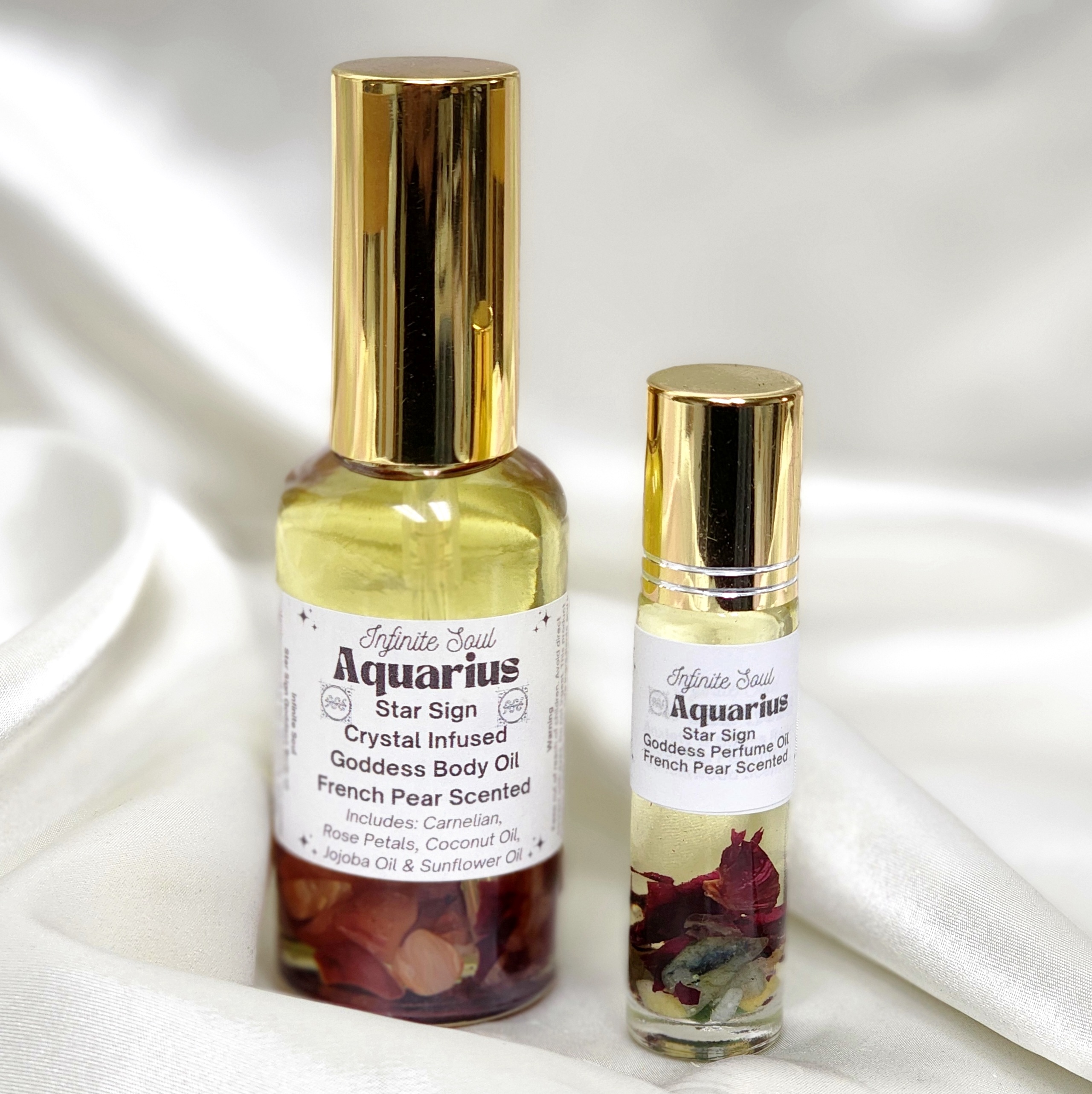 Aquarius Star Sign Crystal Infused Goddess Body Oil with French Pear scent, featuring Carnelian crystal chips and natural oils.