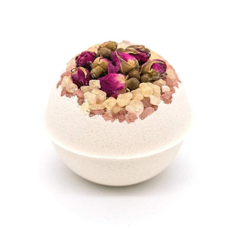Artisan Wild Rose Petal Vegan Bath Bomb with whole rose buds and petals, showcasing its vibrant colors and luxurious texture.