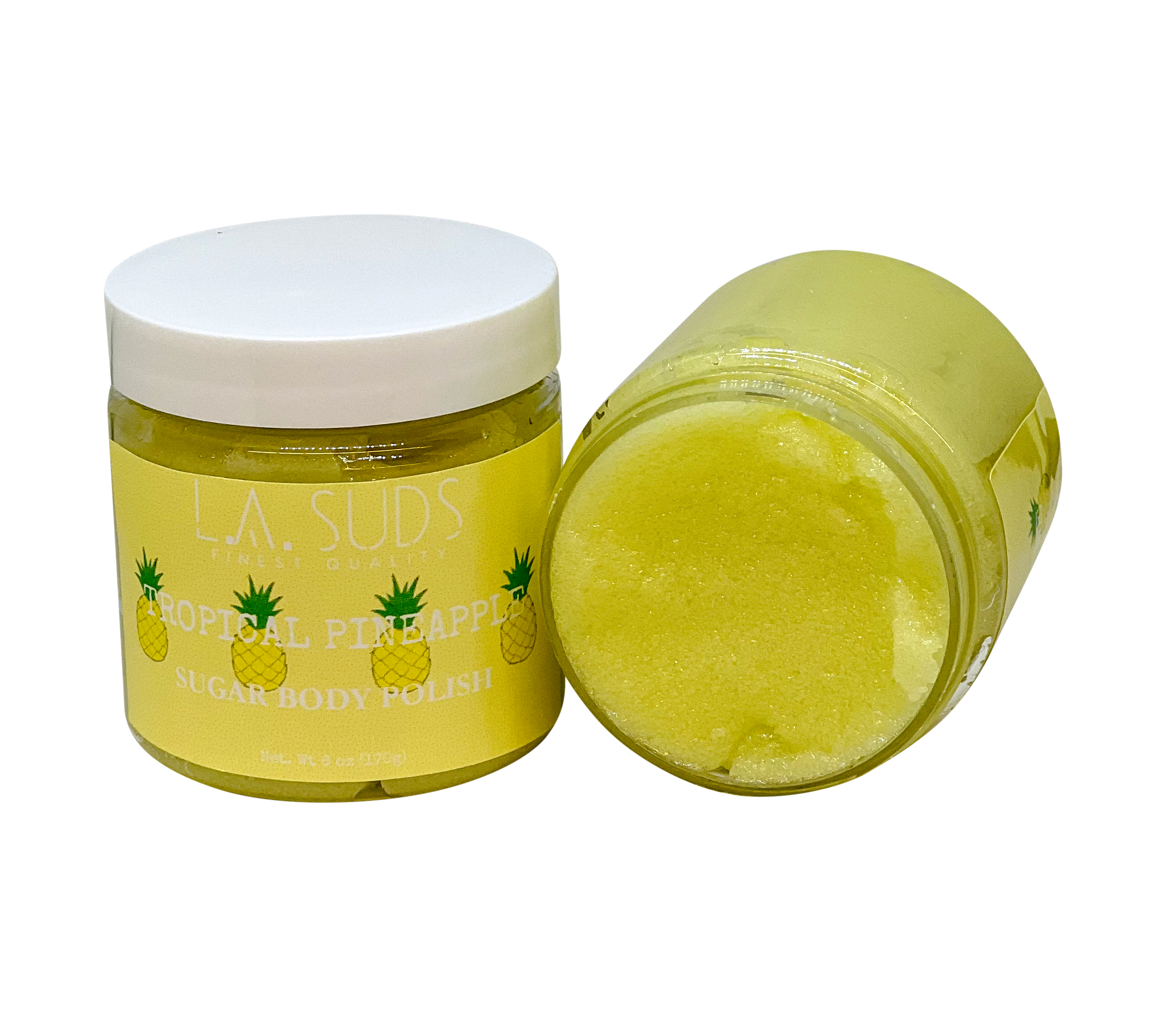 A jar of Body Sugar Scrub Polish with a tropical pineapple scent, showcasing its creamy texture and vibrant packaging.