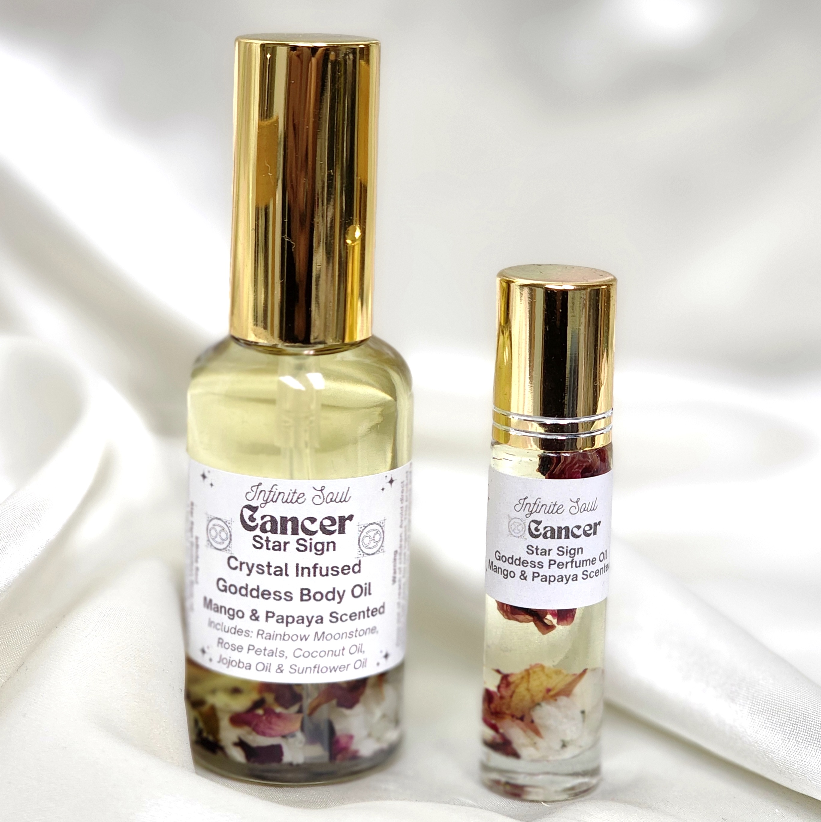 Cancer Star Sign Crystal Infused Goddess Body Oil with mango scent, featuring Rainbow Moonstone crystal chips and natural ingredients.