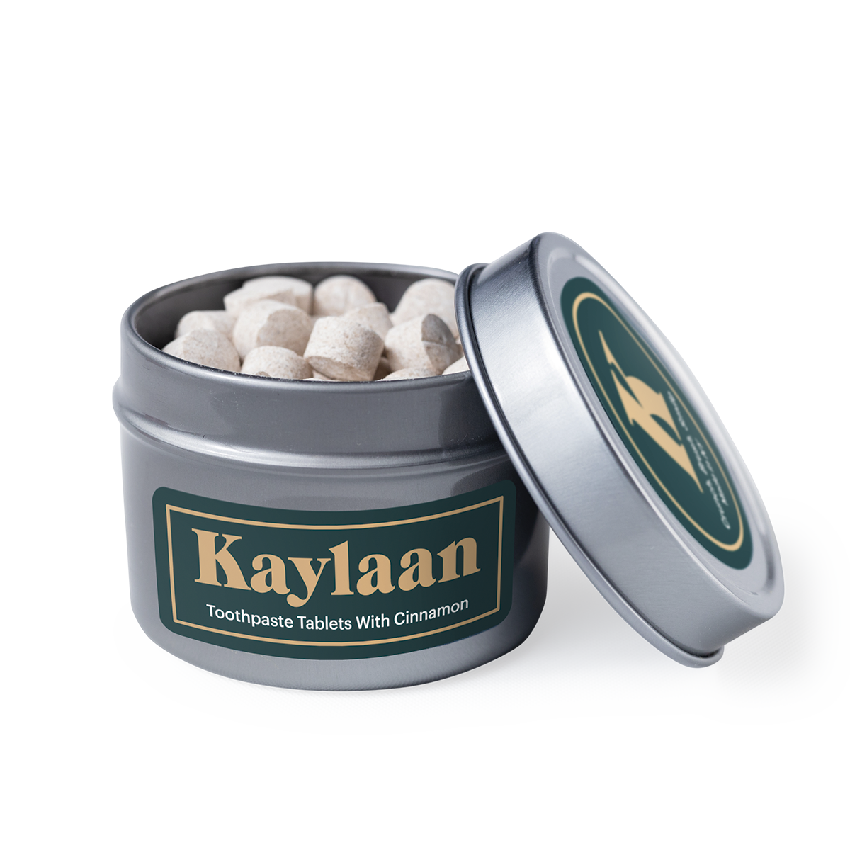 Cinnamon Toothpaste Tablets in a small eco-friendly package, showcasing their unique shape and color.