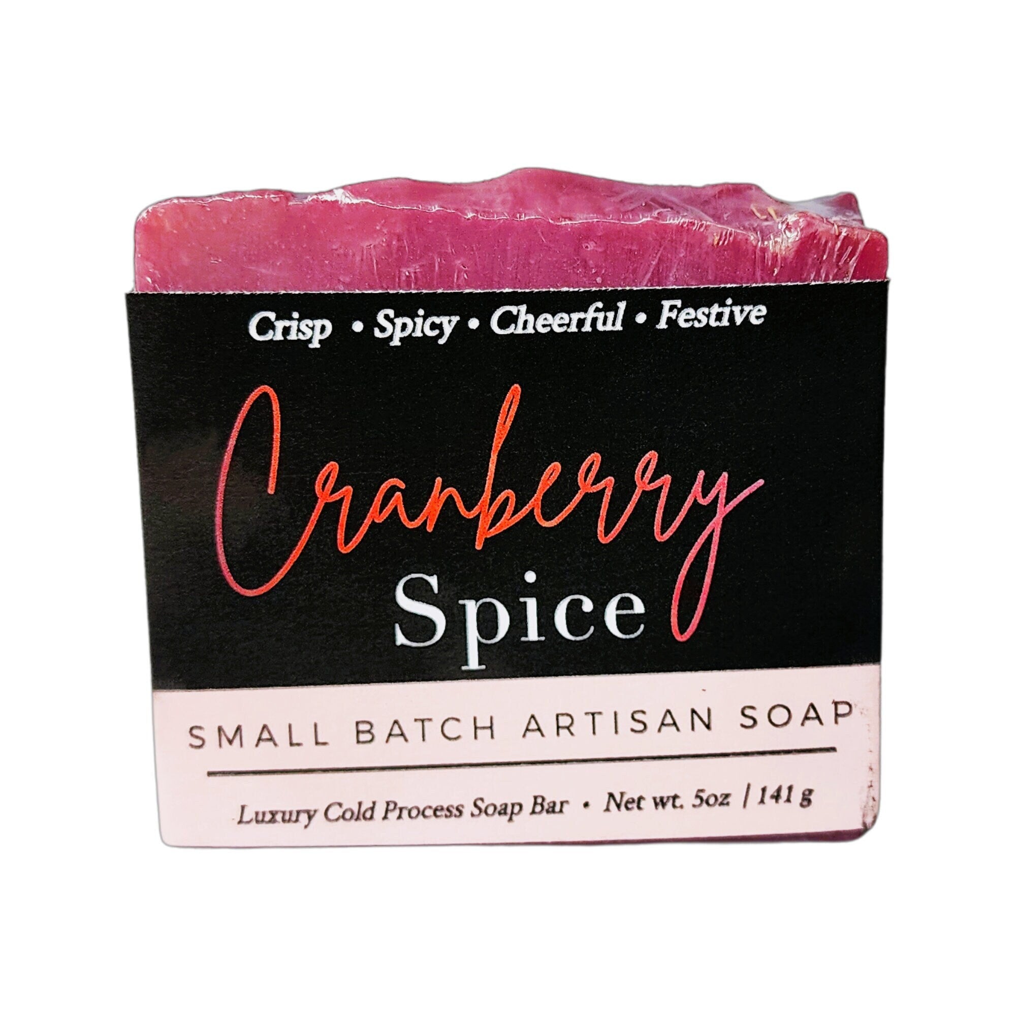 Cranberry Spice Soap bar with a deep cranberry color, showcasing its handcrafted texture and warm, spicy aroma.