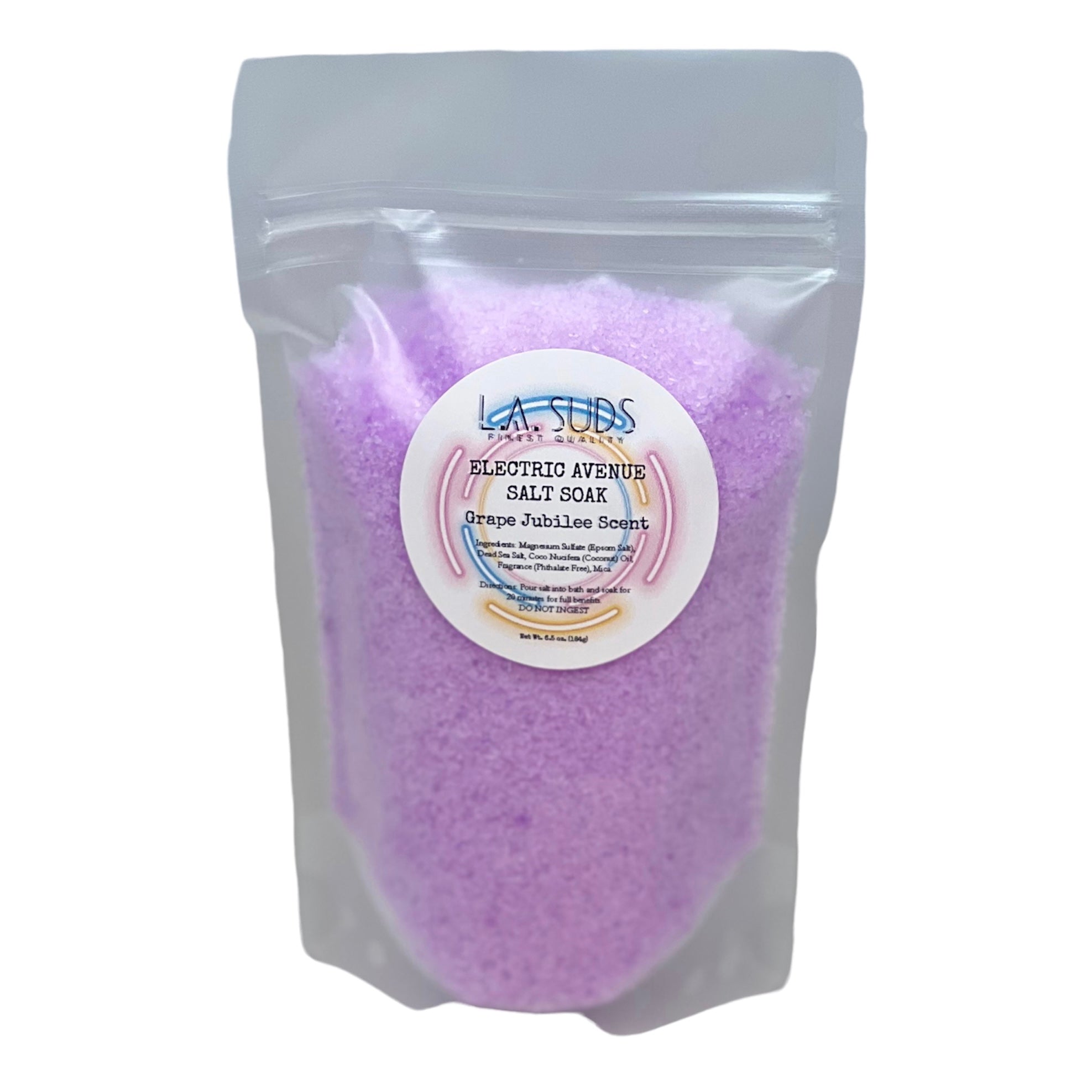 Electric Avenue Salt Soak in Grape Jubilee scent, showcasing its vibrant packaging and salt texture.