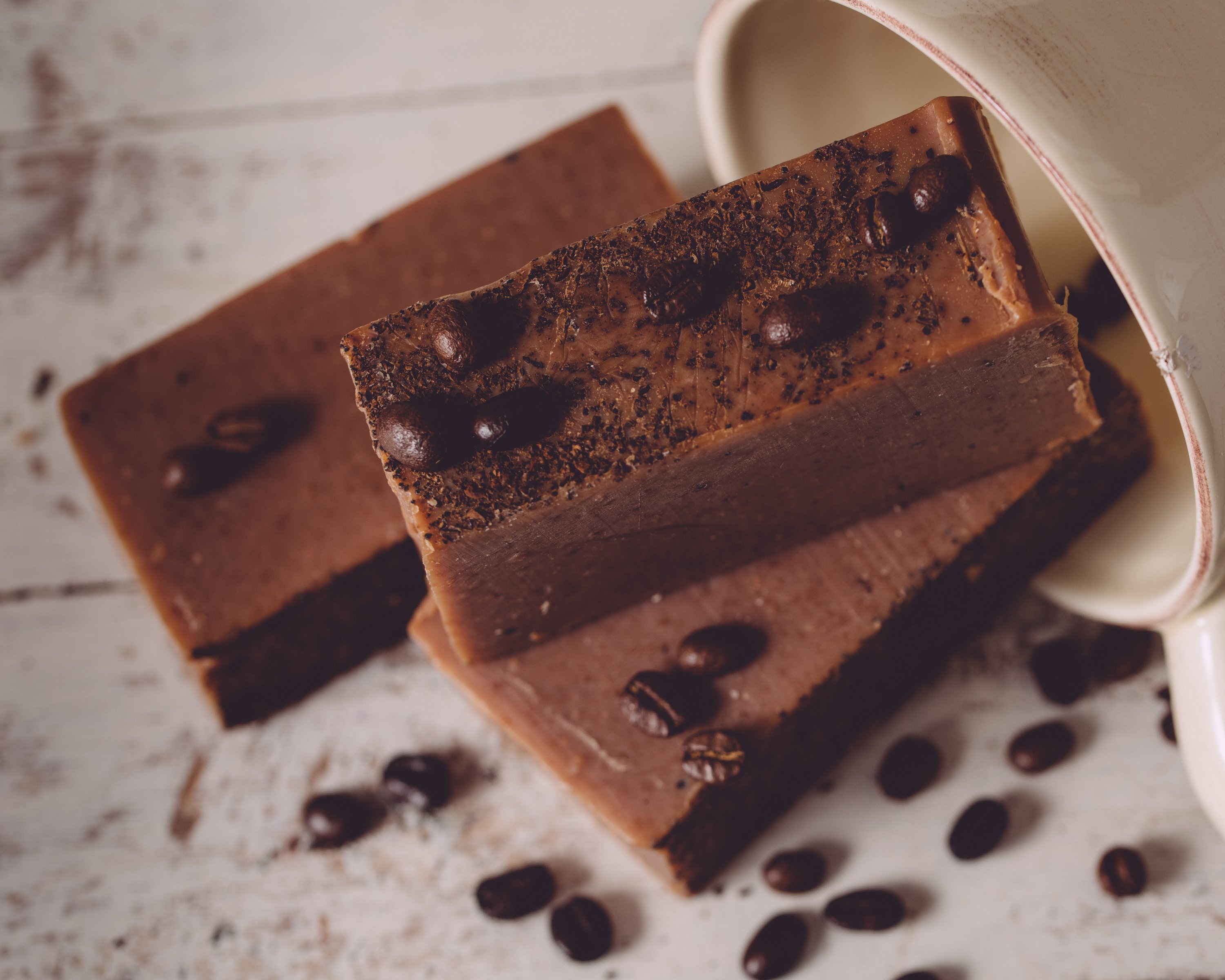 Espresso Yourself Exfoliating Organic Handmade Coffee Soap bar with coffee grounds and natural oils, showcasing its rich texture and organic ingredients.