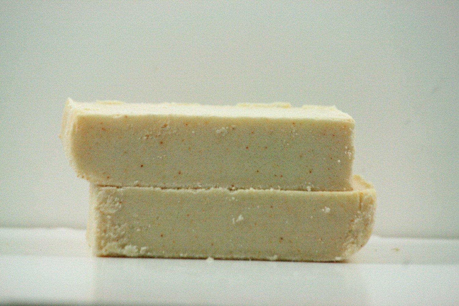 Lemongrass Sea Salt Bar with creamy texture and vibrant color, showcasing its luxurious lather and natural ingredients.