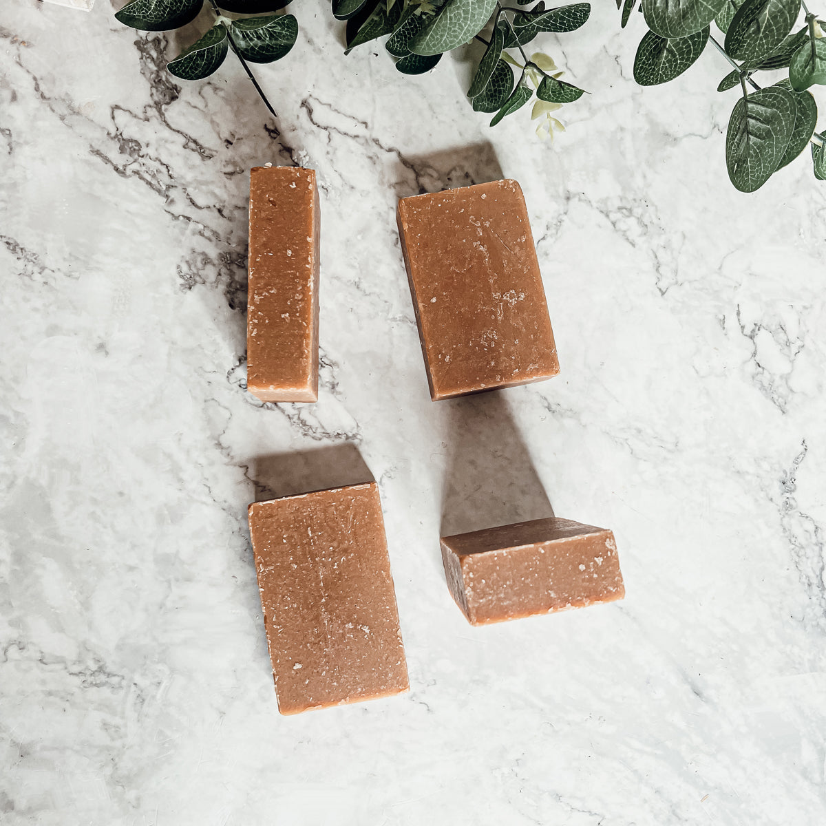 A bar of Nag Champa & Clay soap showcasing its earthy color and texture, with a hint of natural fragrance.