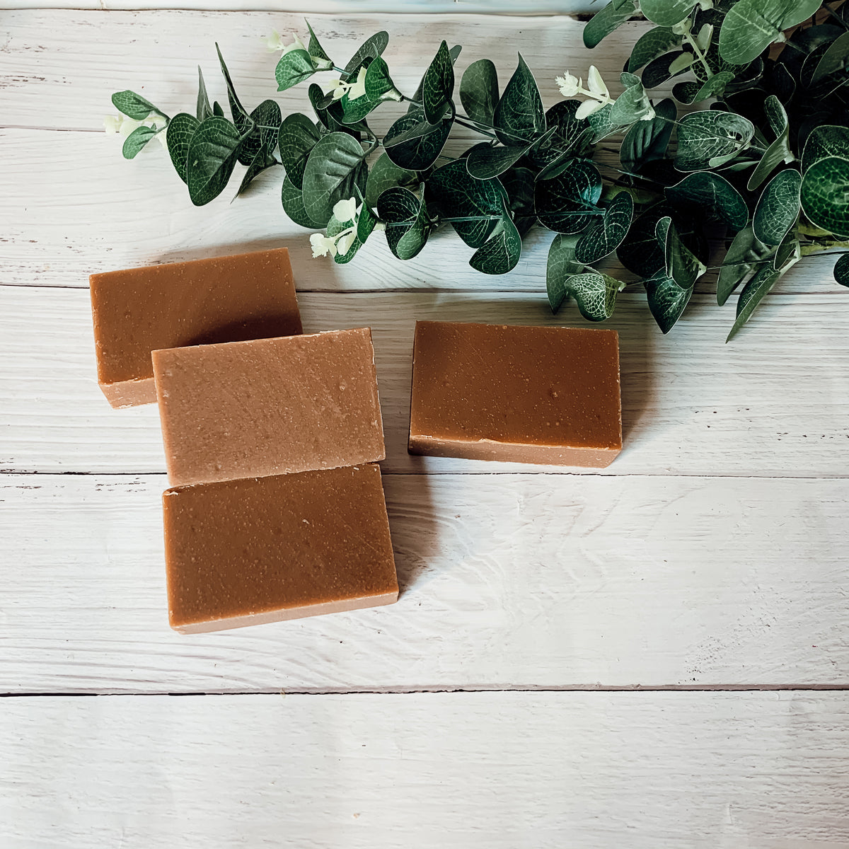 A bar of Nag Champa & Clay soap showcasing its earthy color and texture, with a hint of natural fragrance.