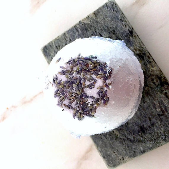 Organic Bath Bomb Calm Bomb in lavender, featuring natural ingredients like shea butter and coconut oil, beautifully packaged for relaxation.