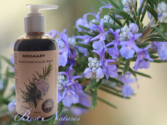 A bottle of Organic Black Soap with Aloe and Rosemary, showcasing its natural ingredients and rich texture, ideal for face and body care.