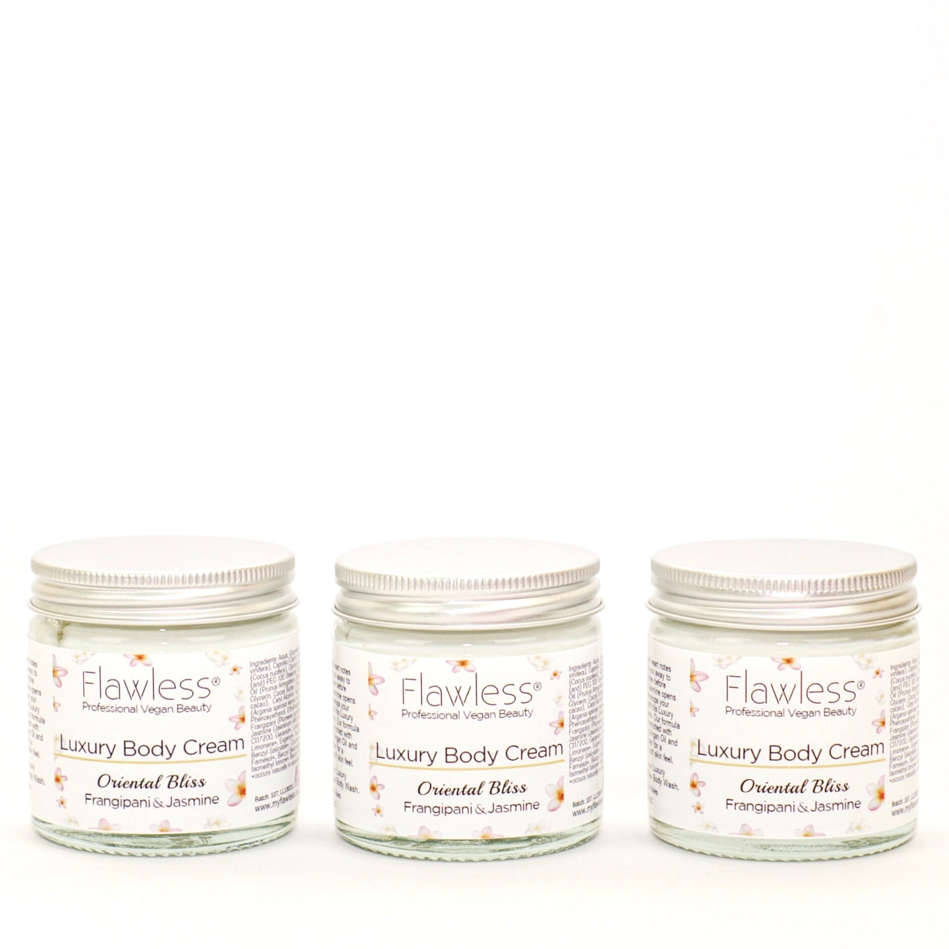 Oriental Bliss Nourishing Body Cream in a recycled glass jar with an aluminum lid, showcasing its eco-friendly packaging and creamy texture.