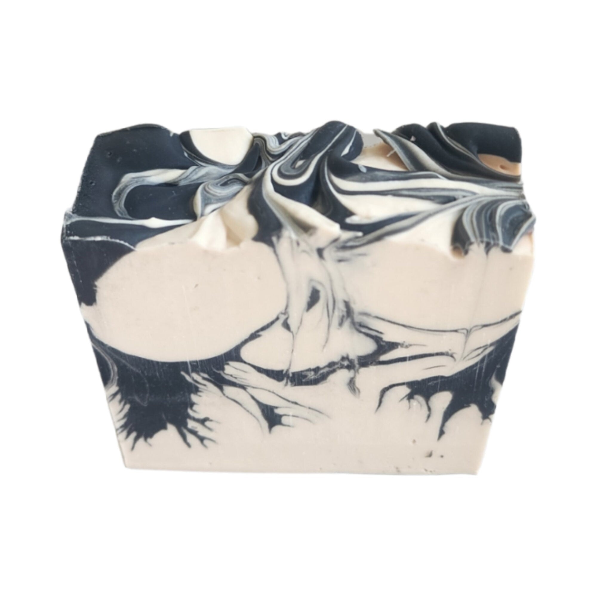 Palo Santo Cedar Soap bar with earthy and woodsy scents, handcrafted and wrapped, showcasing its unique design.