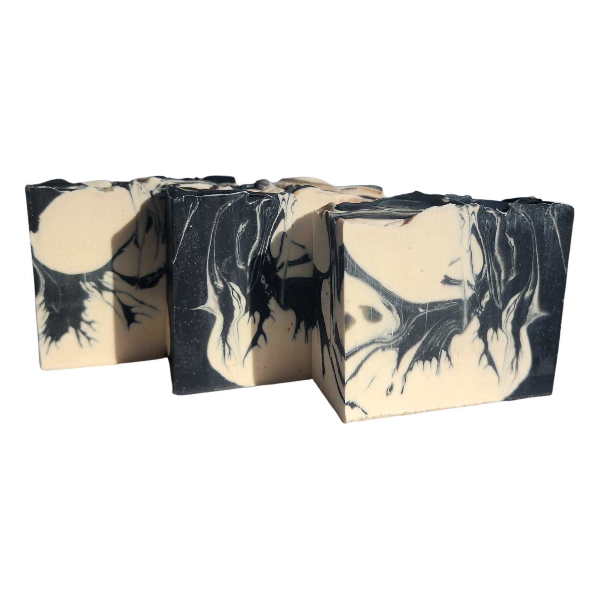 Palo Santo Cedar Soap bar with earthy and woodsy scents, handcrafted and wrapped, showcasing its unique design.