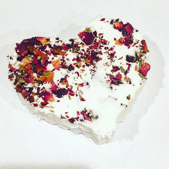 A beautifully crafted Rose Heart Bath Bomb topped with organic rose petals, designed for a luxurious bathing experience.
