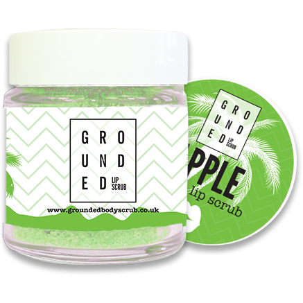 Sour Apple Hydrating Lip Scrub in a jar, showcasing its vibrant green color and sugar granules, perfect for exfoliating and hydrating lips.