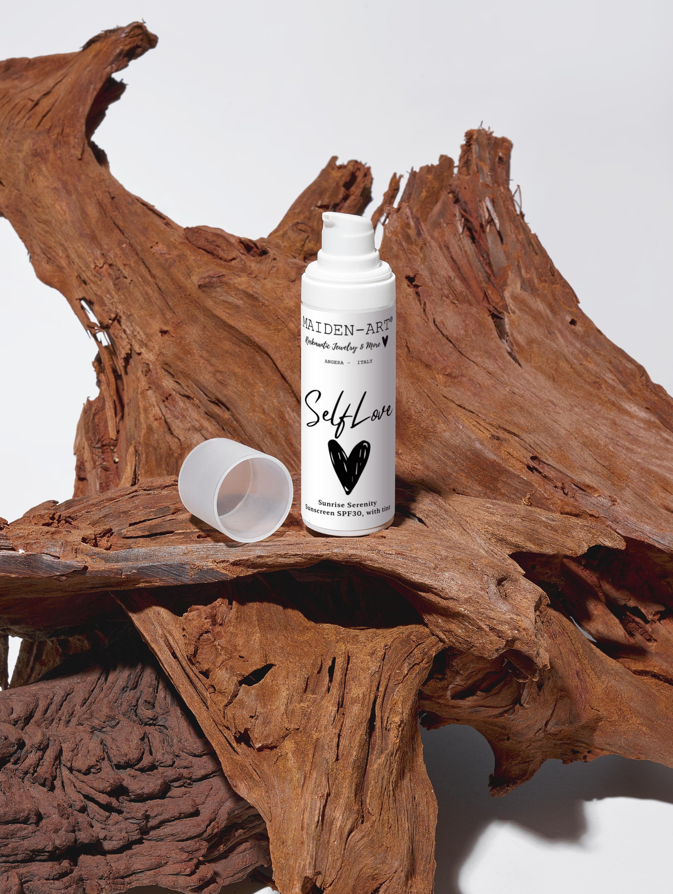 Sunrise Serenity tinted sunscreen SPF30 in a recyclable white tube, showcasing its natural ingredients and eco-friendly packaging.