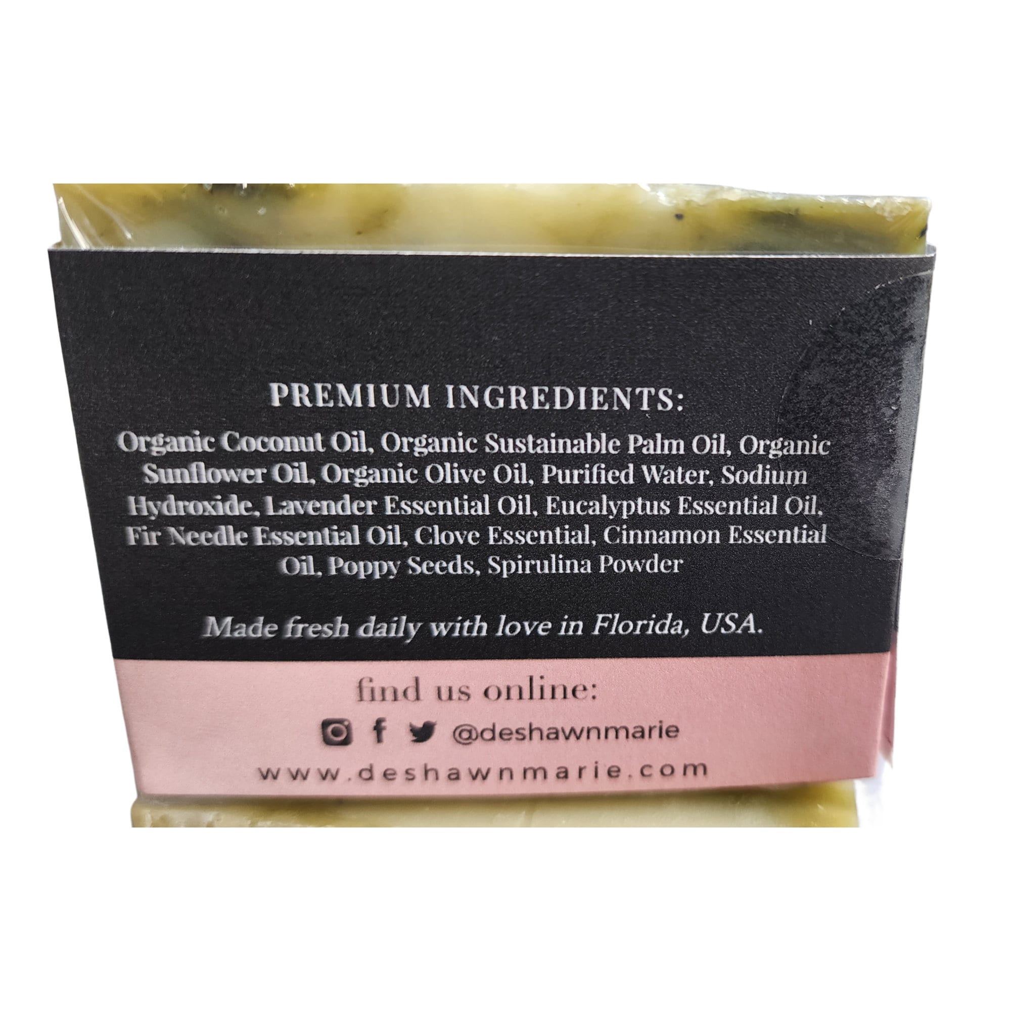 Handmade soap packaging with ingredients.