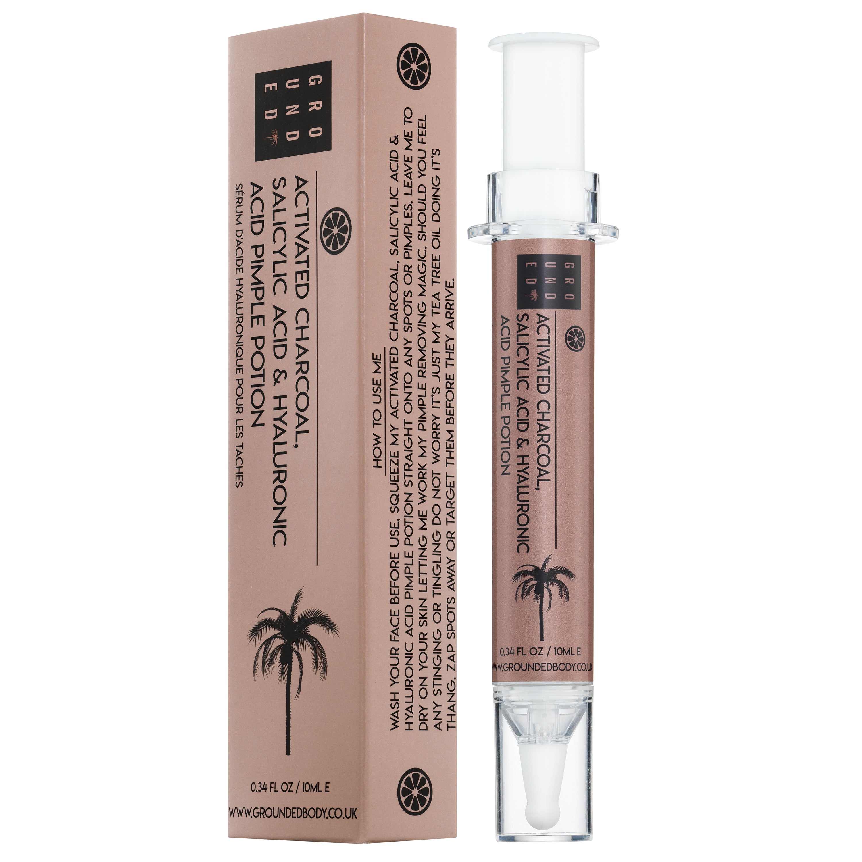 The Pimple Potion serum bottle featuring activated charcoal and salicylic acid for acne treatment, with a syringe applicator for precise use.