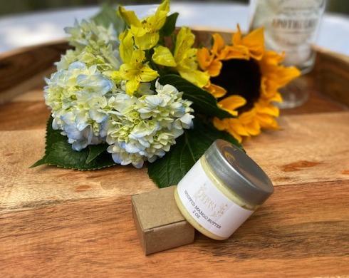 A jar of Vegan Whipped Mango Butter showcasing its creamy texture, ideal for hydrating sensitive skin areas.