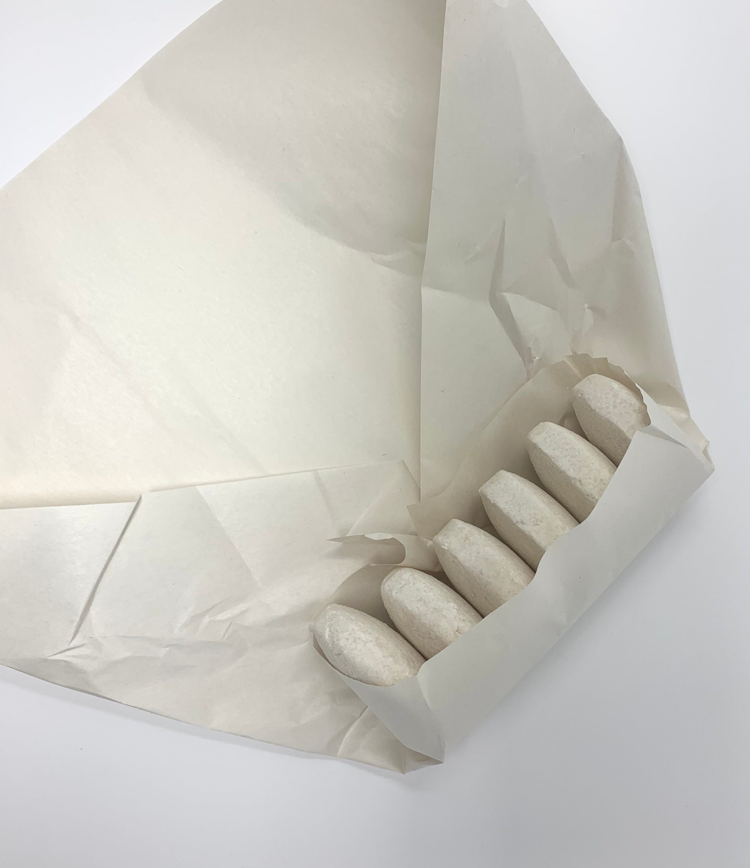 A pack of six Coco Cabana shampoo bars with a coconut lime scent, designed for deep cleansing oily hair, displayed on a wooden surface.