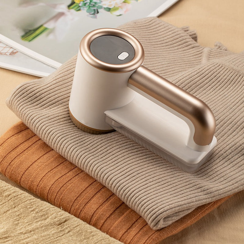 Hair Ball Trimmer with LED display and USB charging, showcasing its ergonomic design and removable fluff catcher.