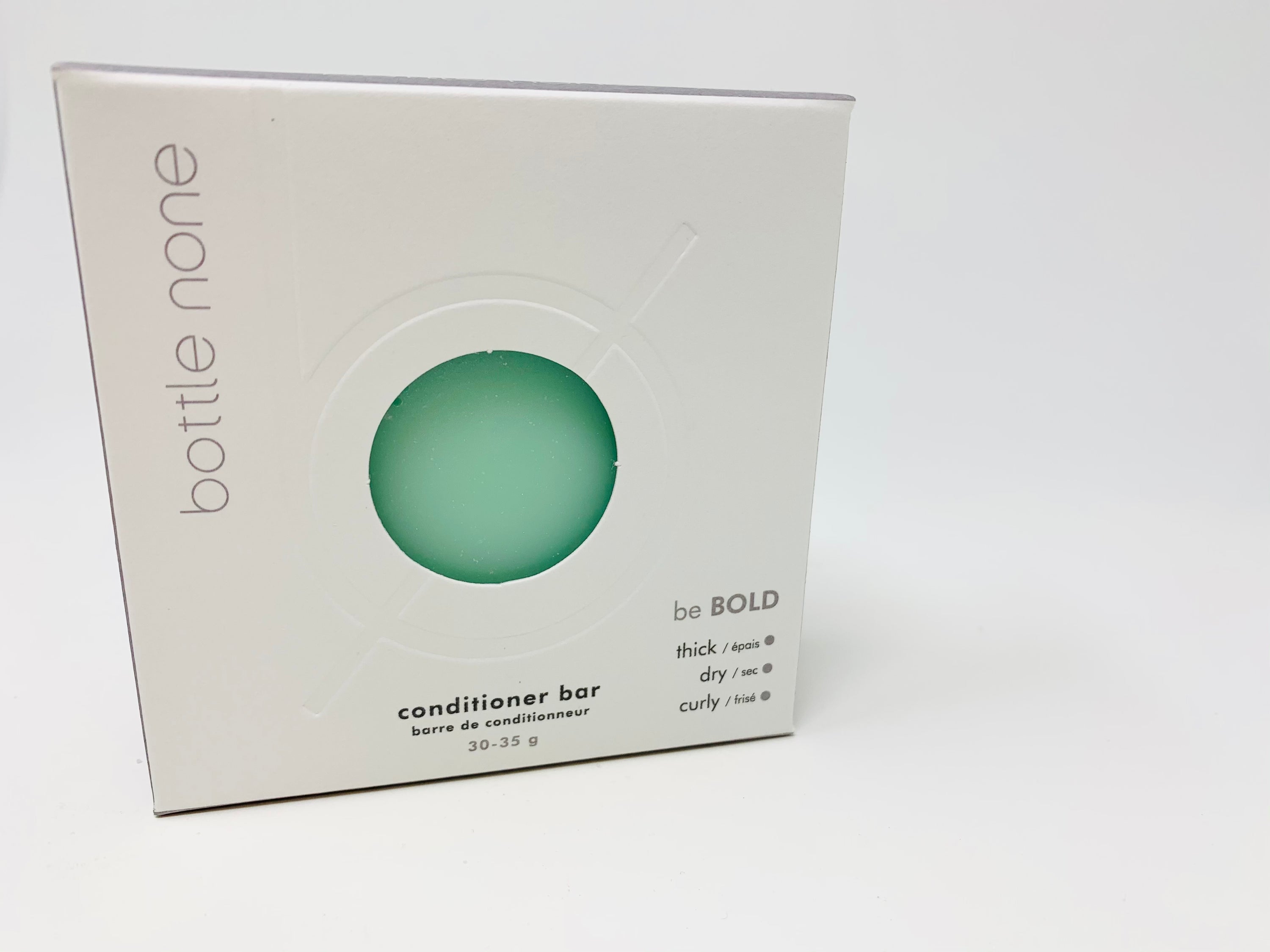 be BOLD Conditioner Bar for thick, dry, and curly hair, showcasing its natural ingredients and eco-friendly packaging.