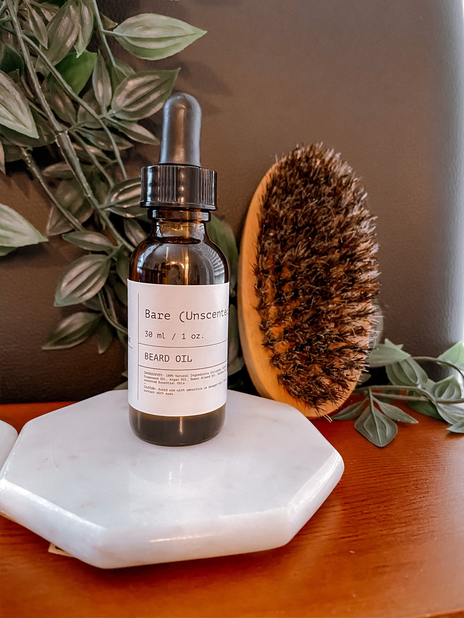 Bottle of Bare Unscented Beard Oil with a sleek design, showcasing its all-natural ingredients for beard care.