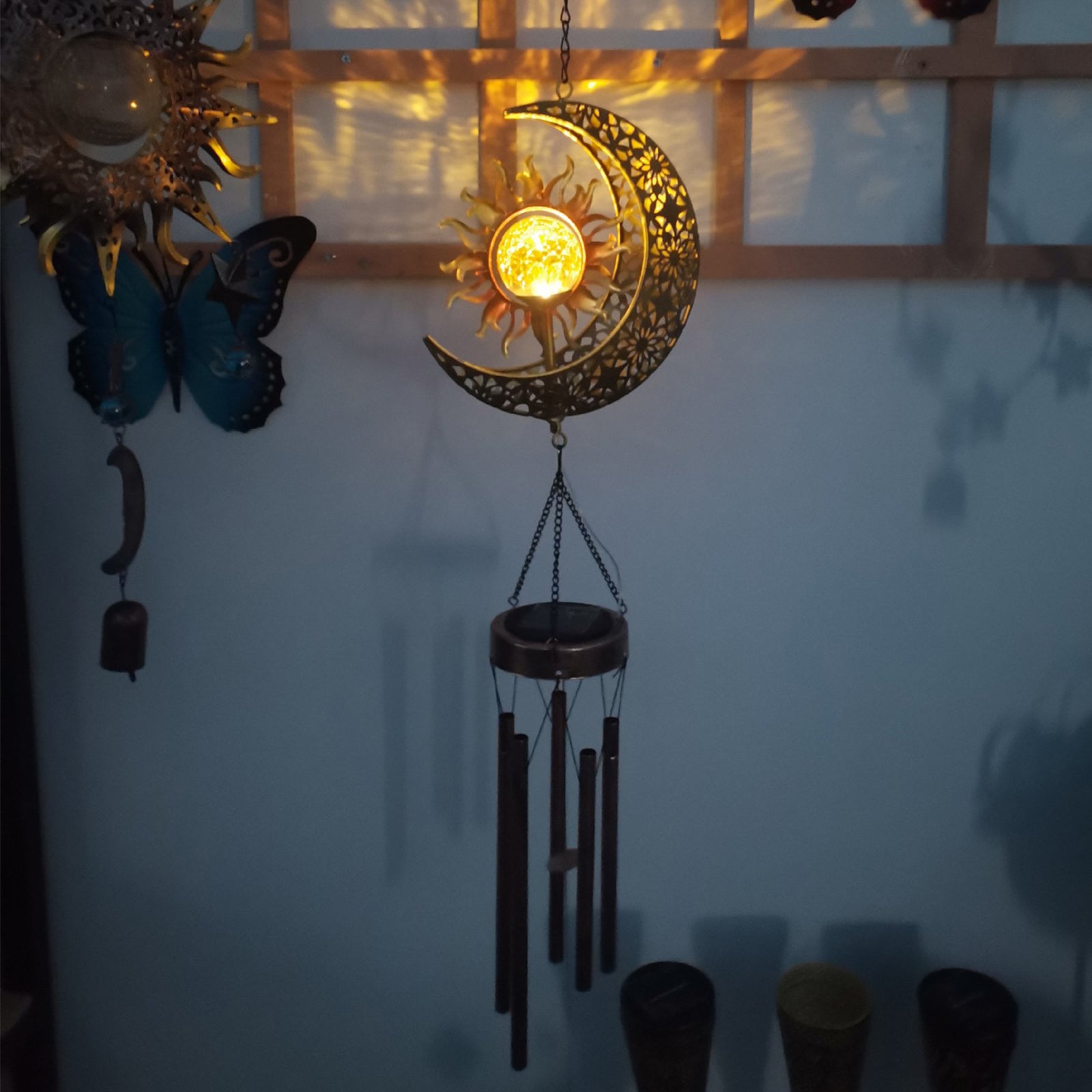 A beautiful solar wind chime light in moon shape, showcasing its elegant design and glowing softly at night, perfect for indoor and outdoor decoration.