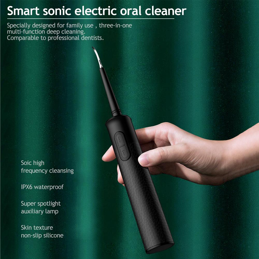 3 in 1 Dental Scaler with replaceable ultrasonic heads and USB charging cable, designed for effective tooth cleaning.