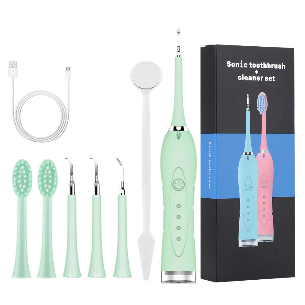 7 in 1 Sonic Electric Dental Calculus Scaler with USB charger and multiple replaceable heads for effective dental cleaning.