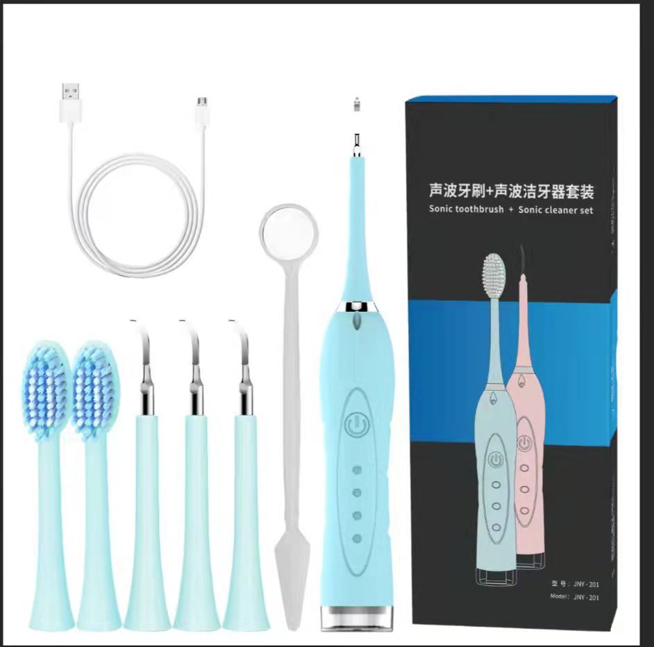 7 in 1 Sonic Electric Dental Calculus Scaler with USB charger and multiple replaceable heads for effective dental cleaning.