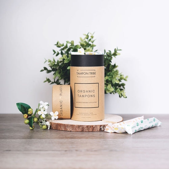 A tube of Super Plus Organic Tampons, 12ct, showcasing eco-friendly packaging and organic cotton tampons.