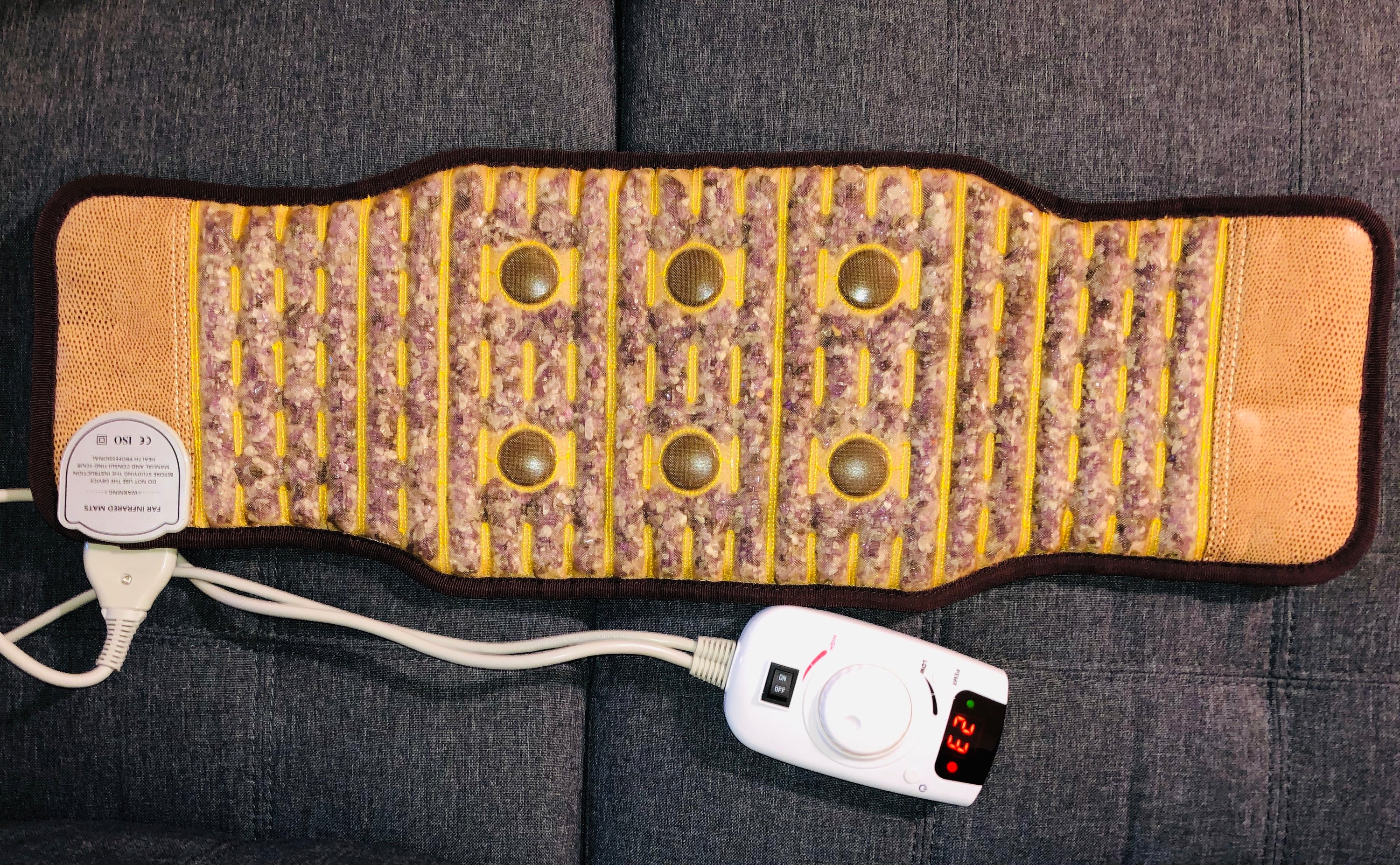 Amethyst PEMF Infrared Heating Belt displayed on a neutral background, showcasing its sleek design and adjustable features.