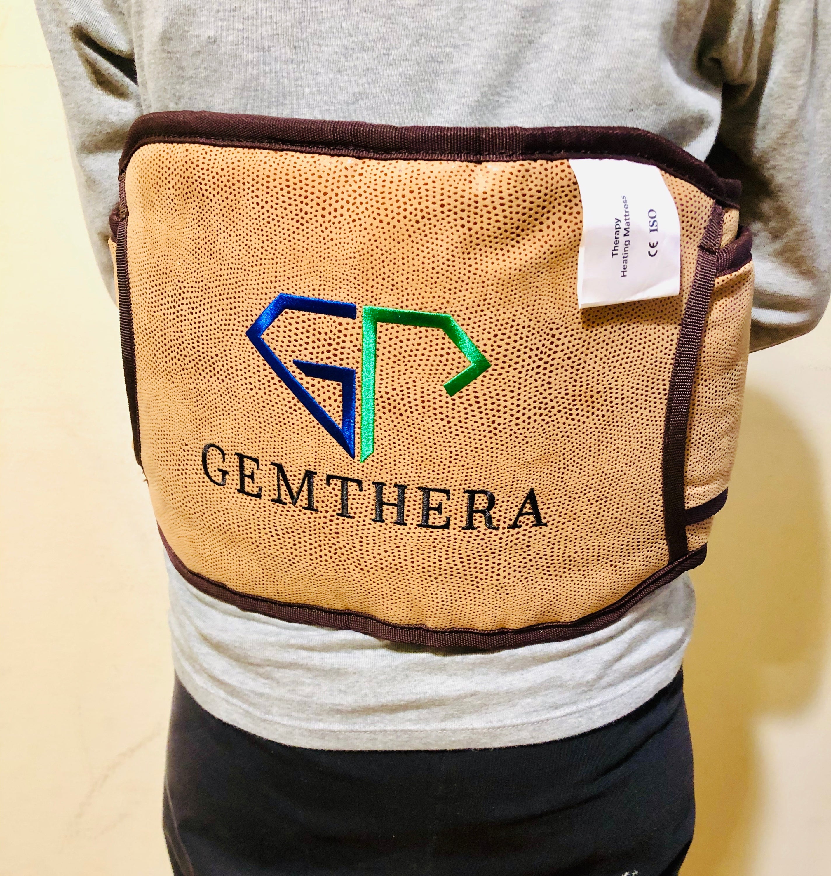 Amethyst PEMF Infrared Heating Belt displayed on a neutral background, showcasing its sleek design and adjustable features.