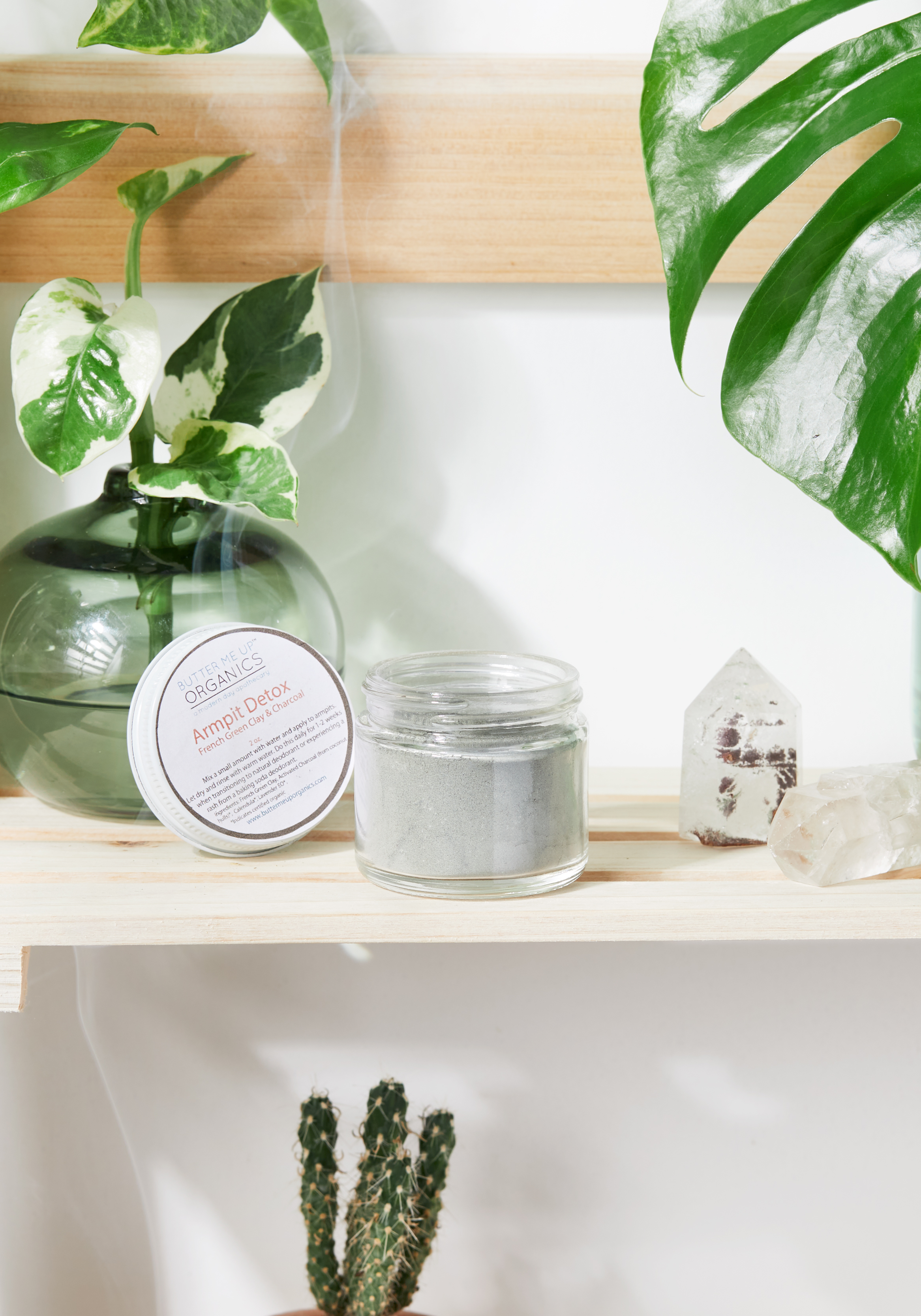 A jar of Arm Pit Detox featuring natural ingredients like French Green Clay, Activated Charcoal, and Lavender, designed for detoxifying underarms.