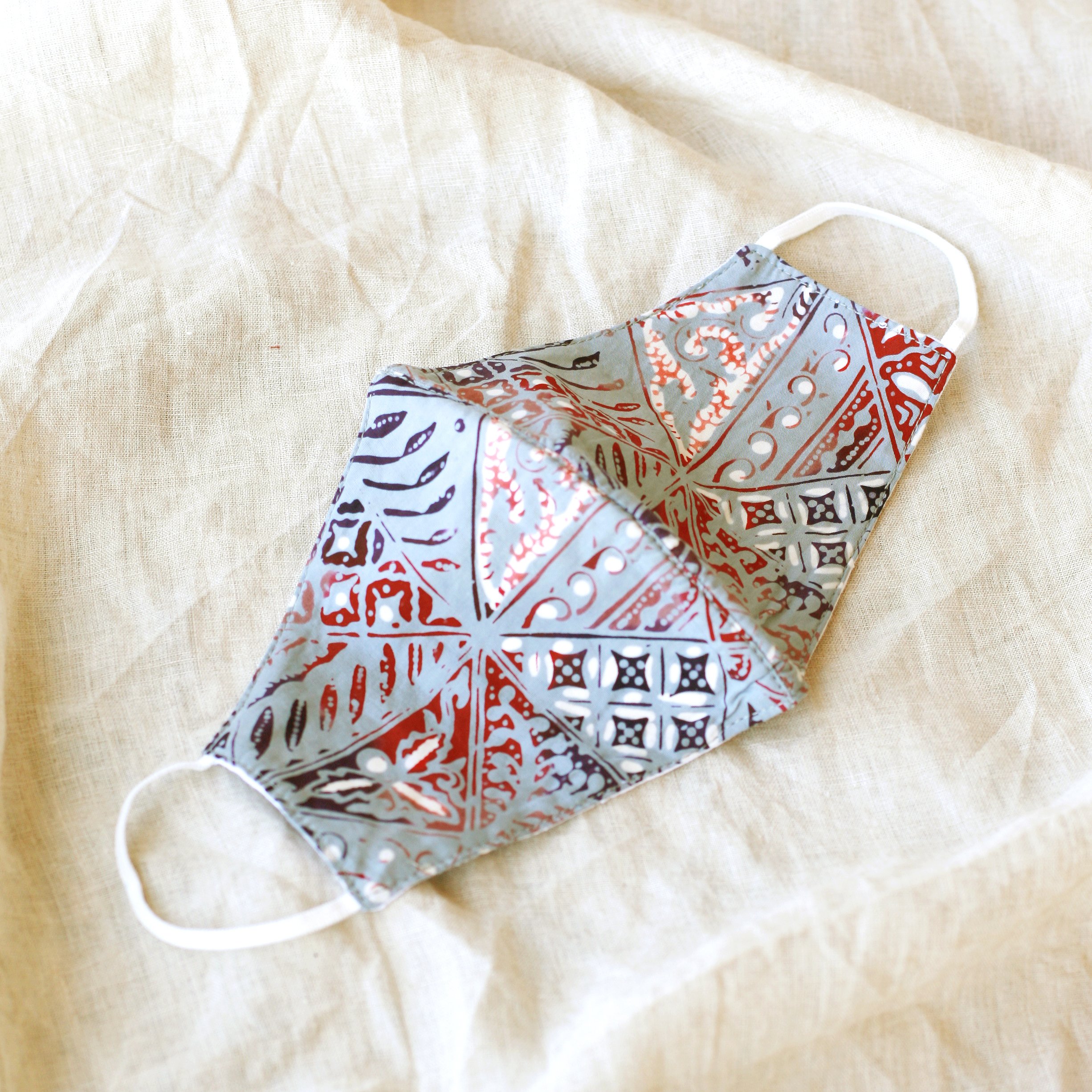 BLUE JAVA Triple Layer Vintage Batik Face Mask featuring intricate Batik patterns, waterproof filter, and elastic ear straps for a secure fit.